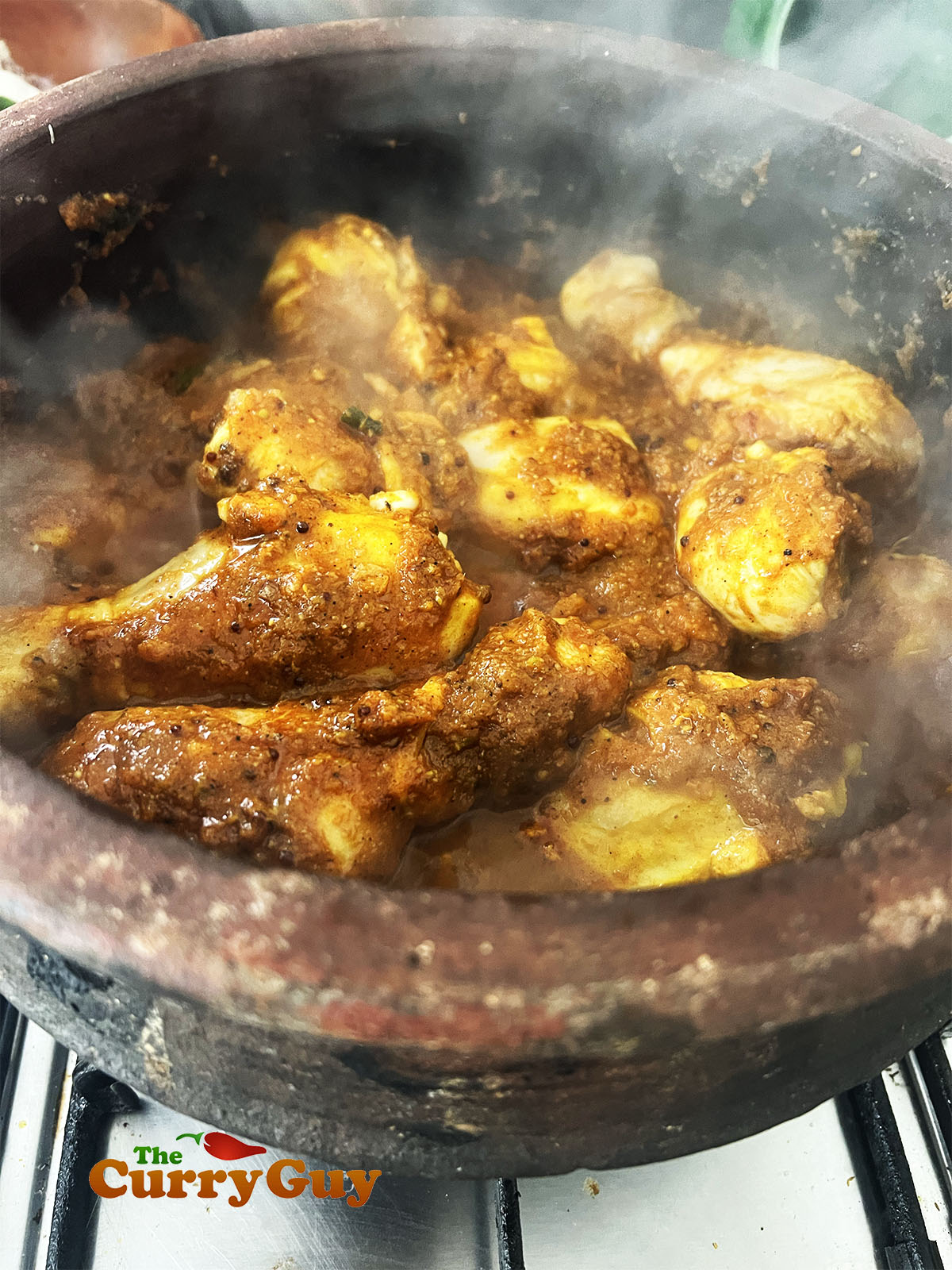 Adding the chicken to the pan.