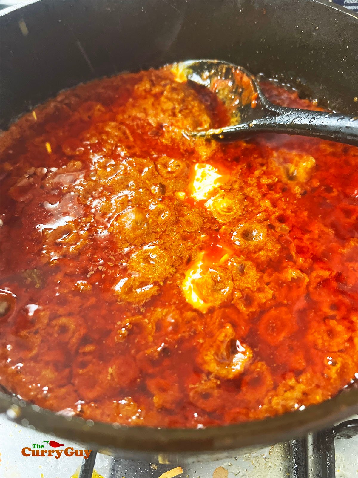 Adding the yoghurt to the pan.