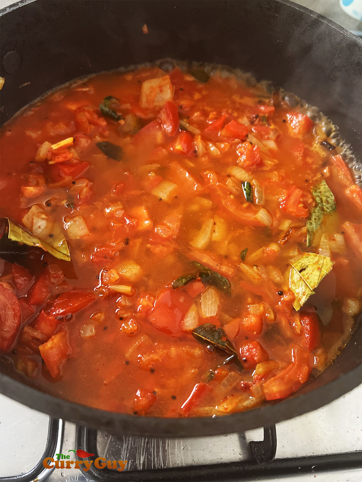 Simmering the Goan pork vindaloo sauce