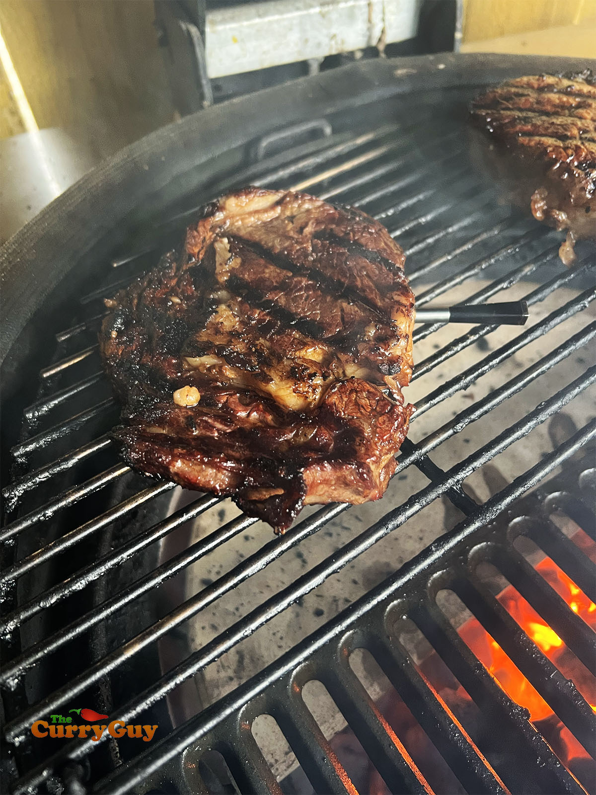 Cooking the steaks on a lower temperature until cooked to medium rare.