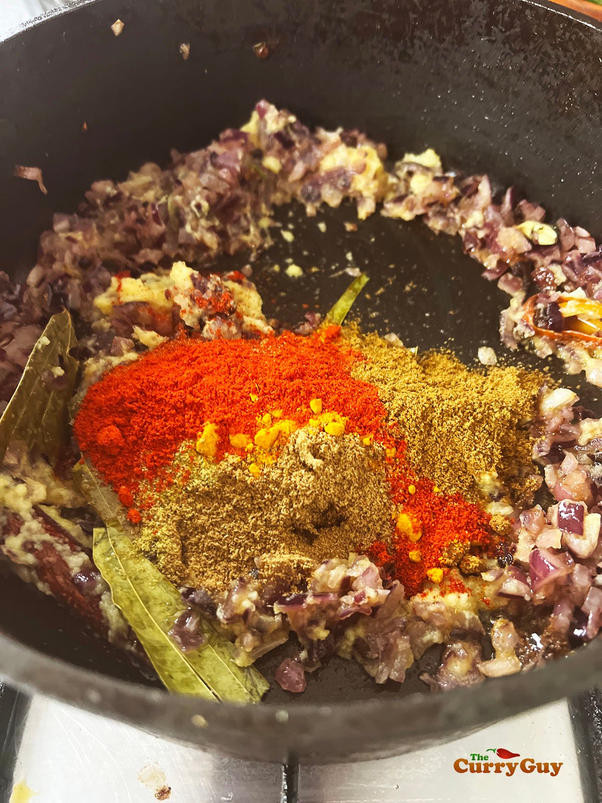 Adding the ground spices to the pan
