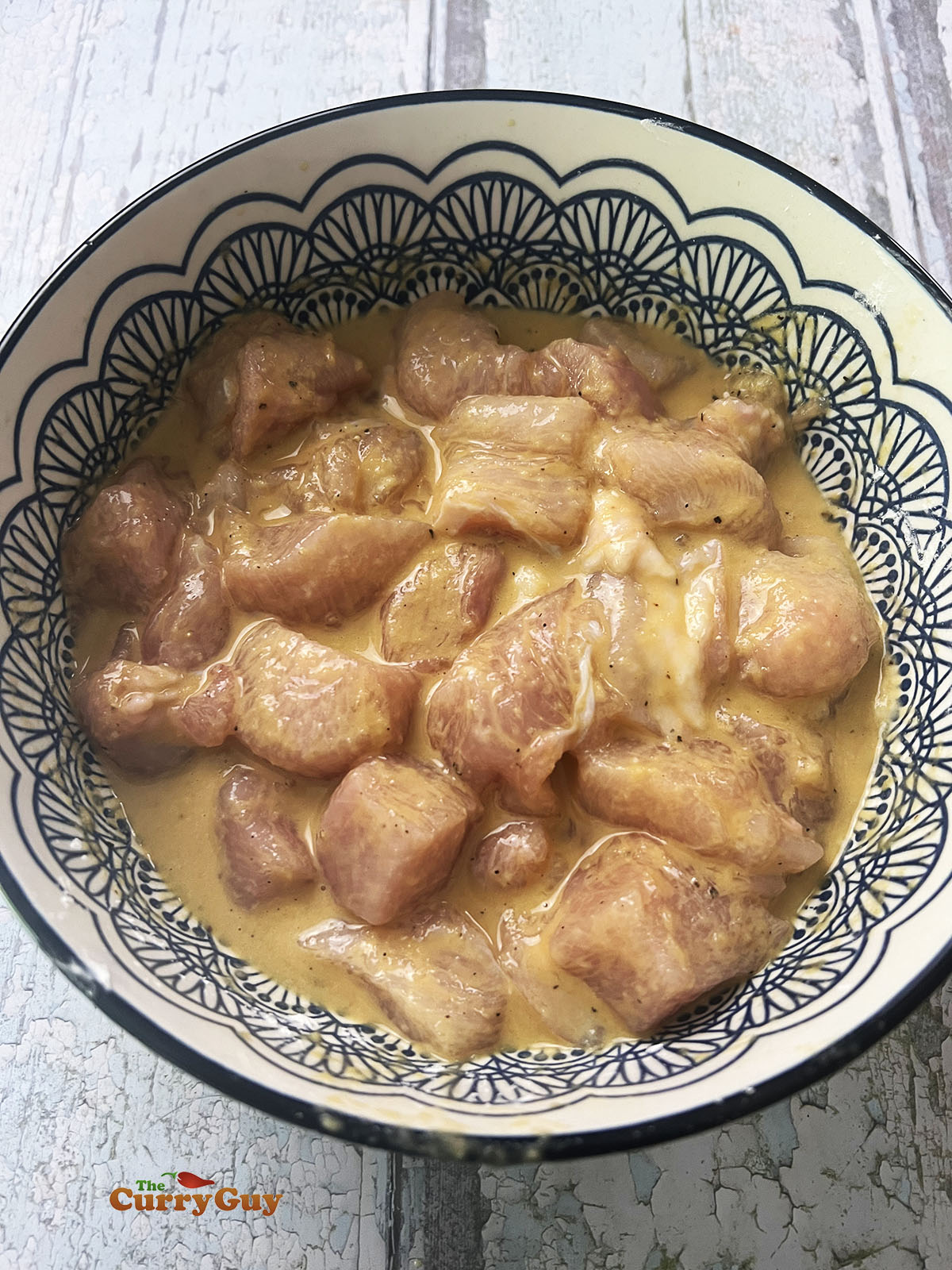 Marinating the meat for the dragon chicken