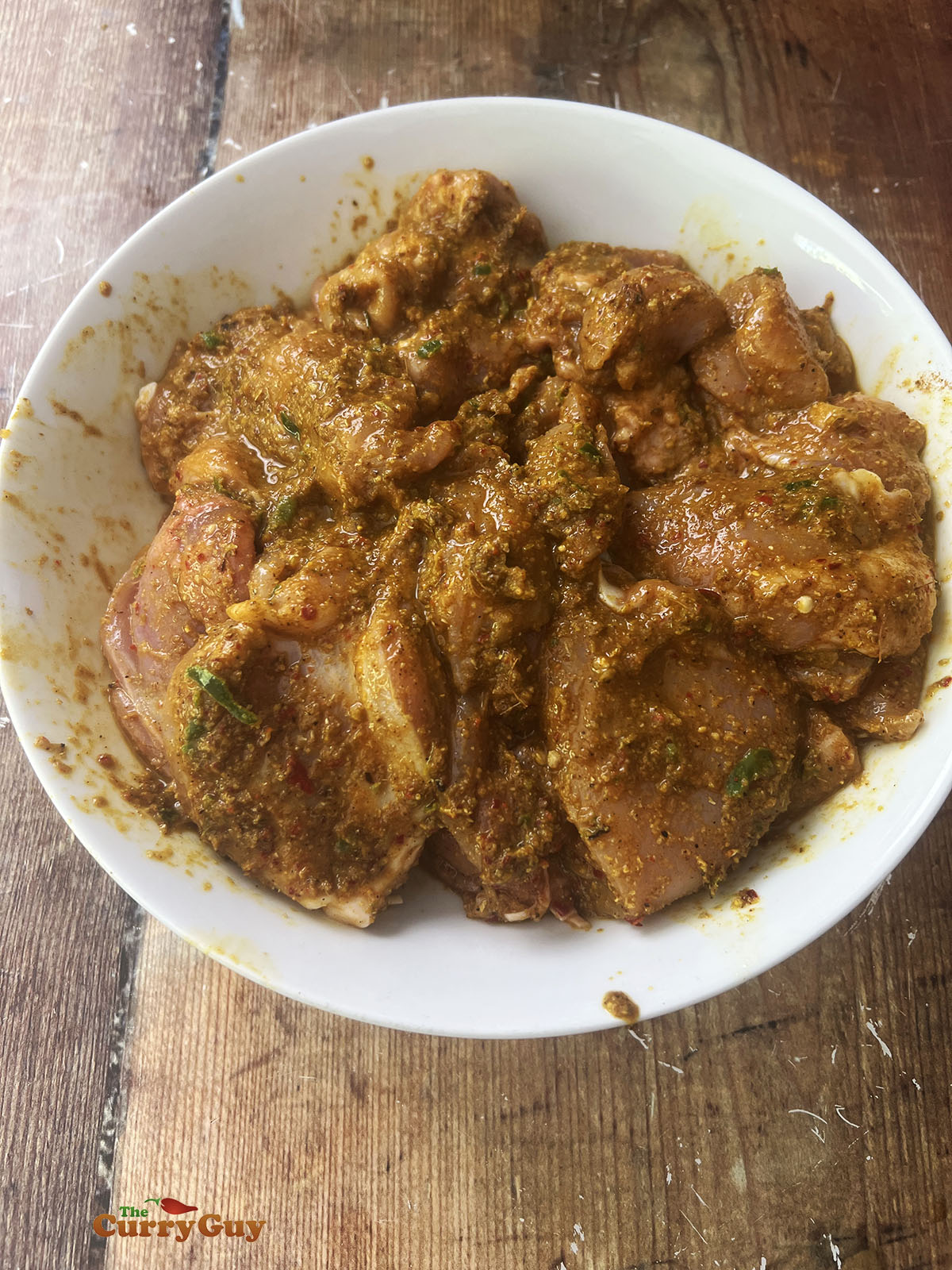 Chicken marinating in the vindaloo marinade.