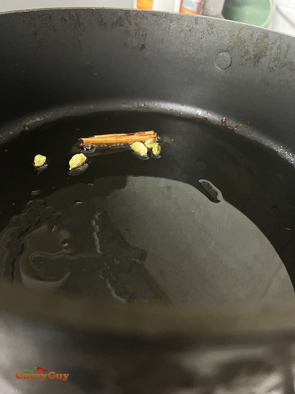 Infusing the whole spices into the oil.