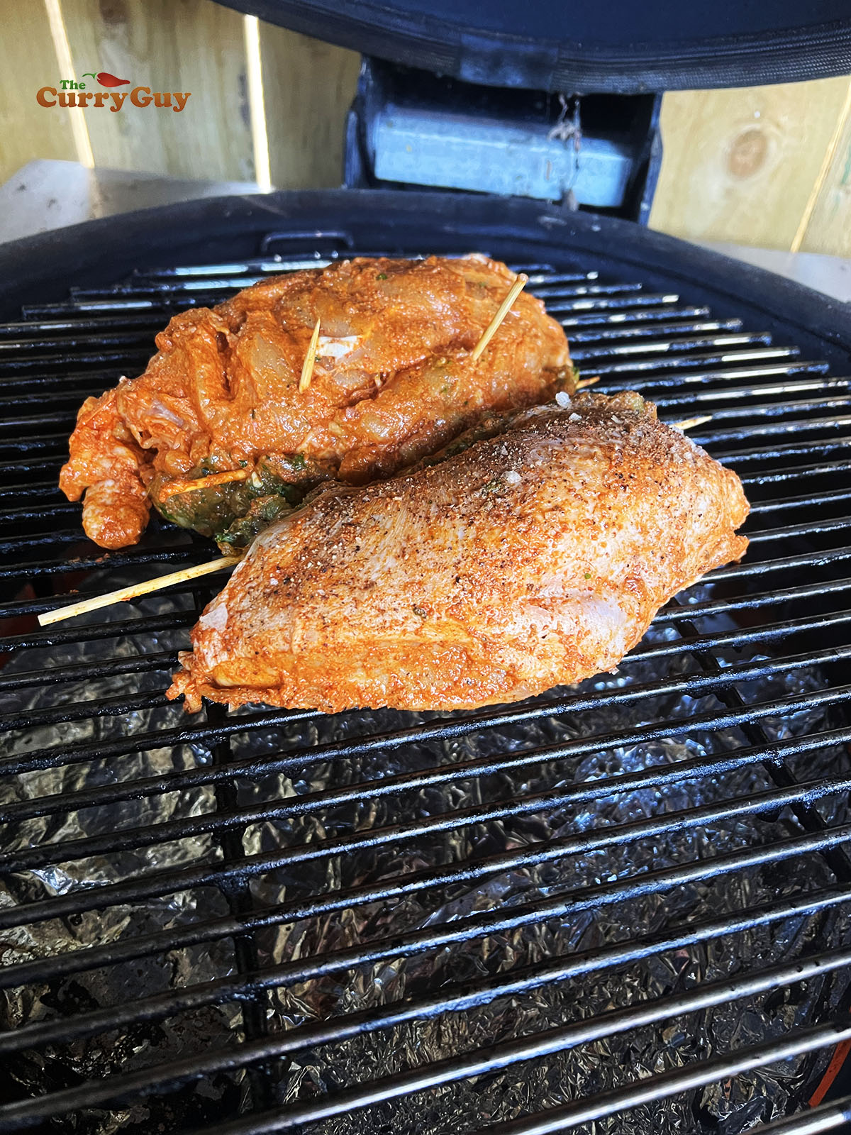 Stuffed tandoori chicken on the barbecue.