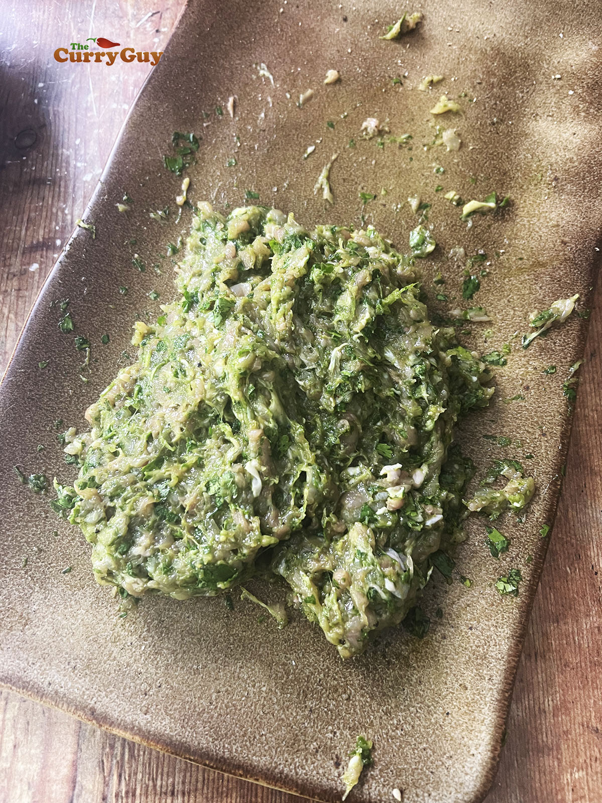 Preparing the minced (ground) chicken stuffing.