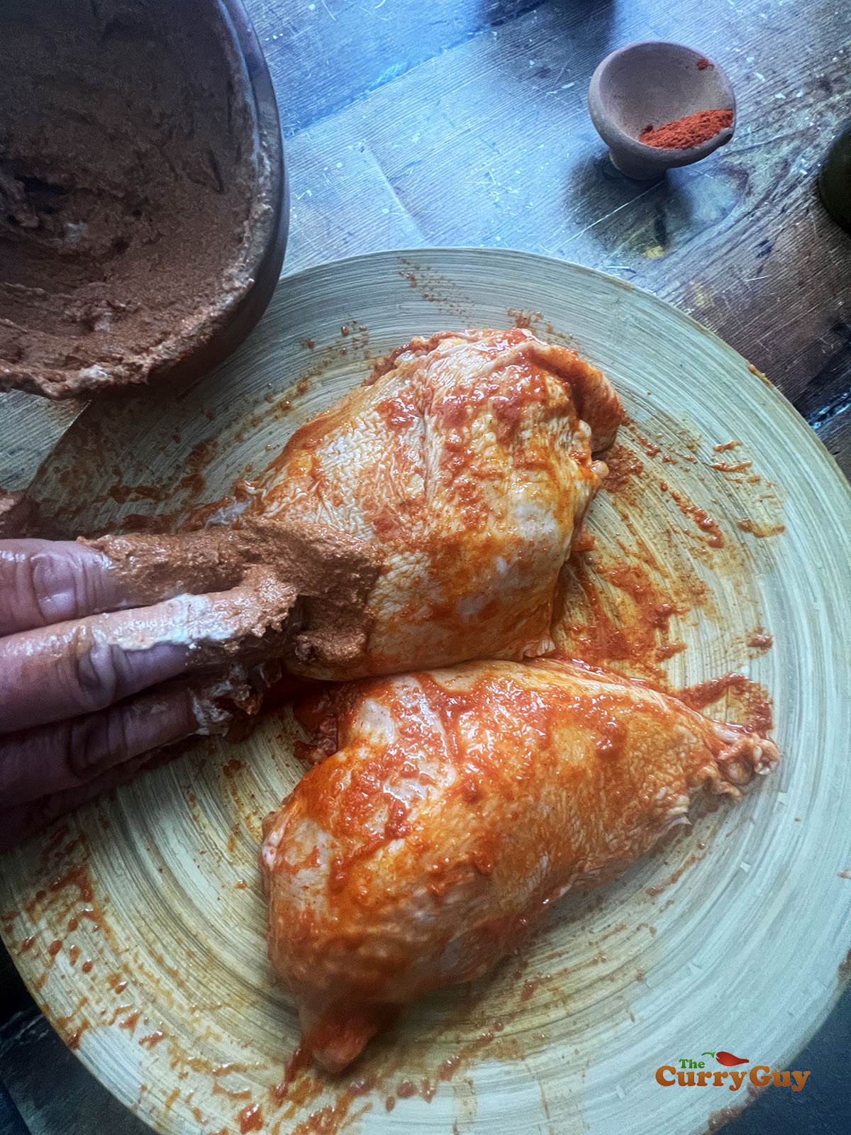 Rubbing on the second marinade.