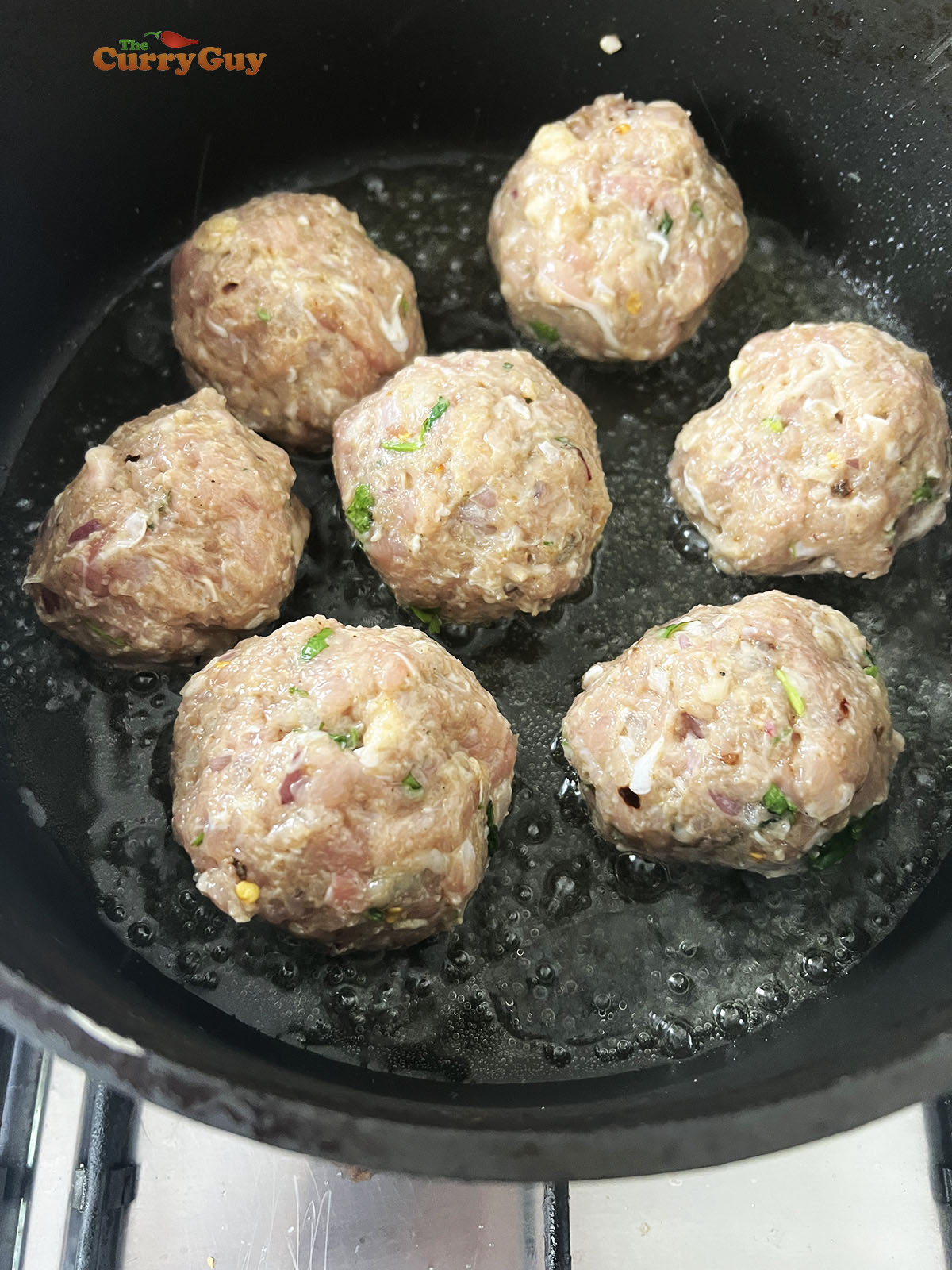 Frying the malai koftas