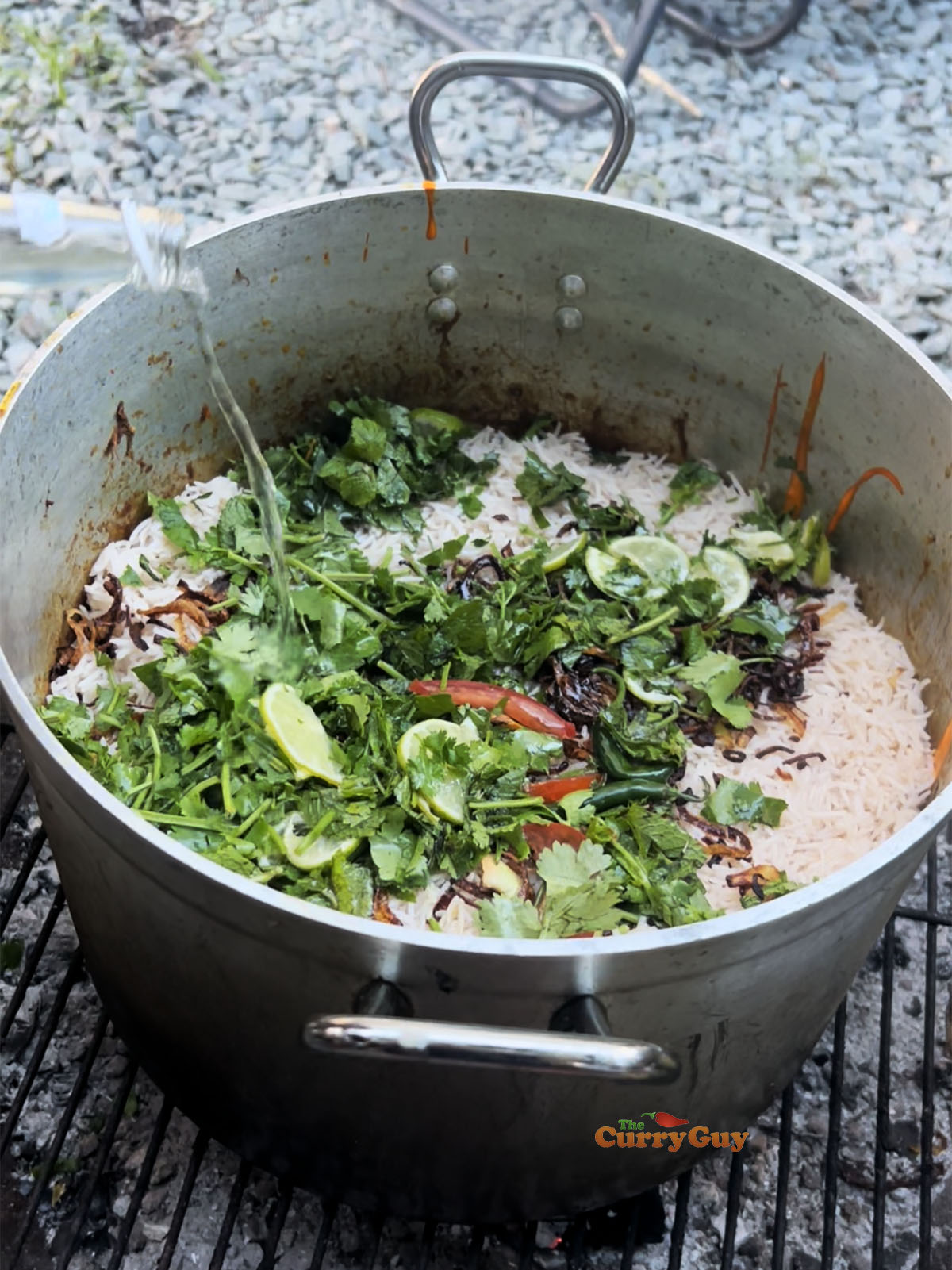 Second layer of the biryani with the remaining rice, herbs and fried onion. Also with drizzled oil and kewra water.