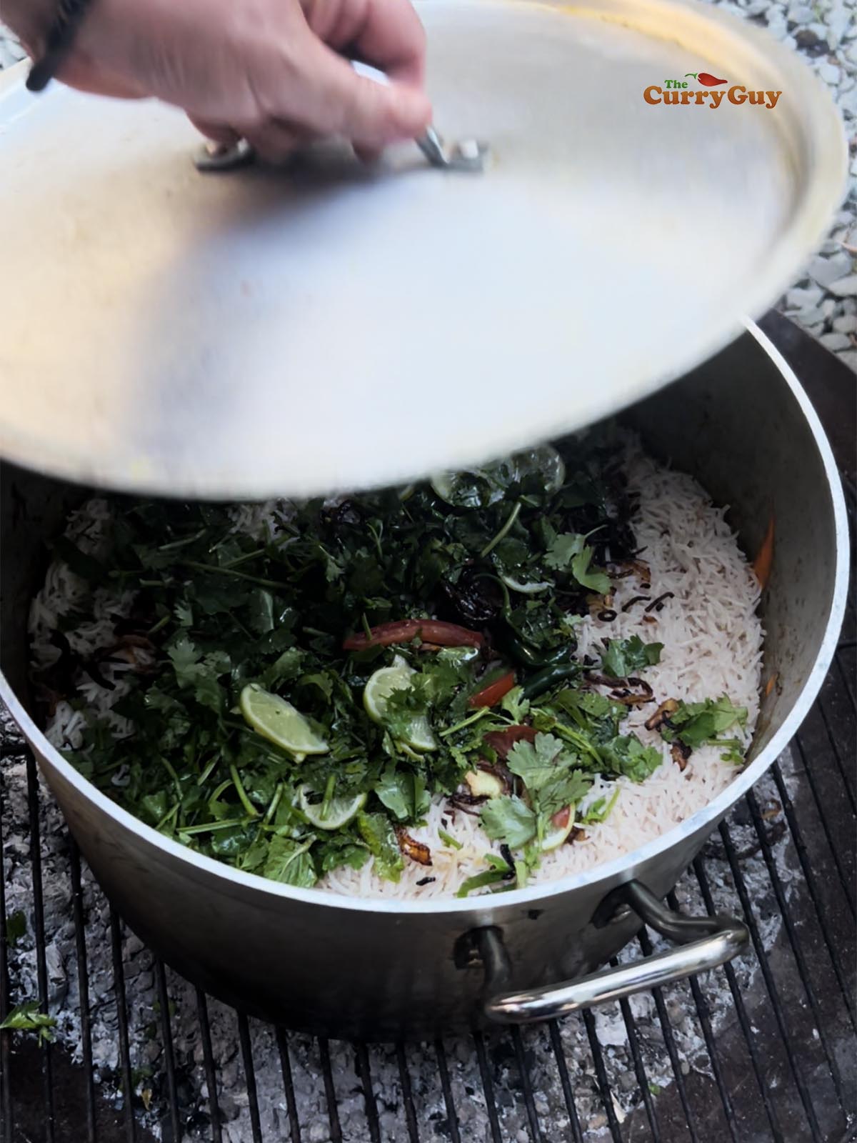 Covering the pot to simmer and steam the rice for 15 minutes