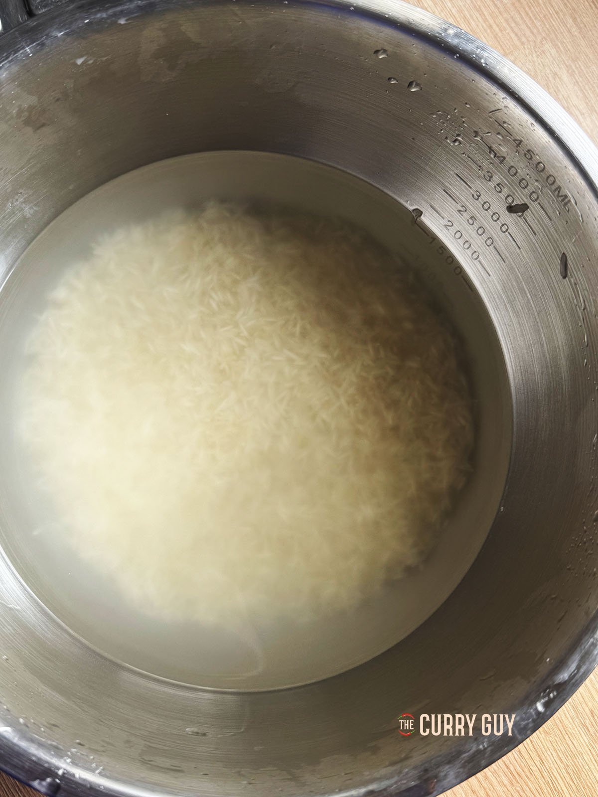 The washed rice in a bowl of water soaking