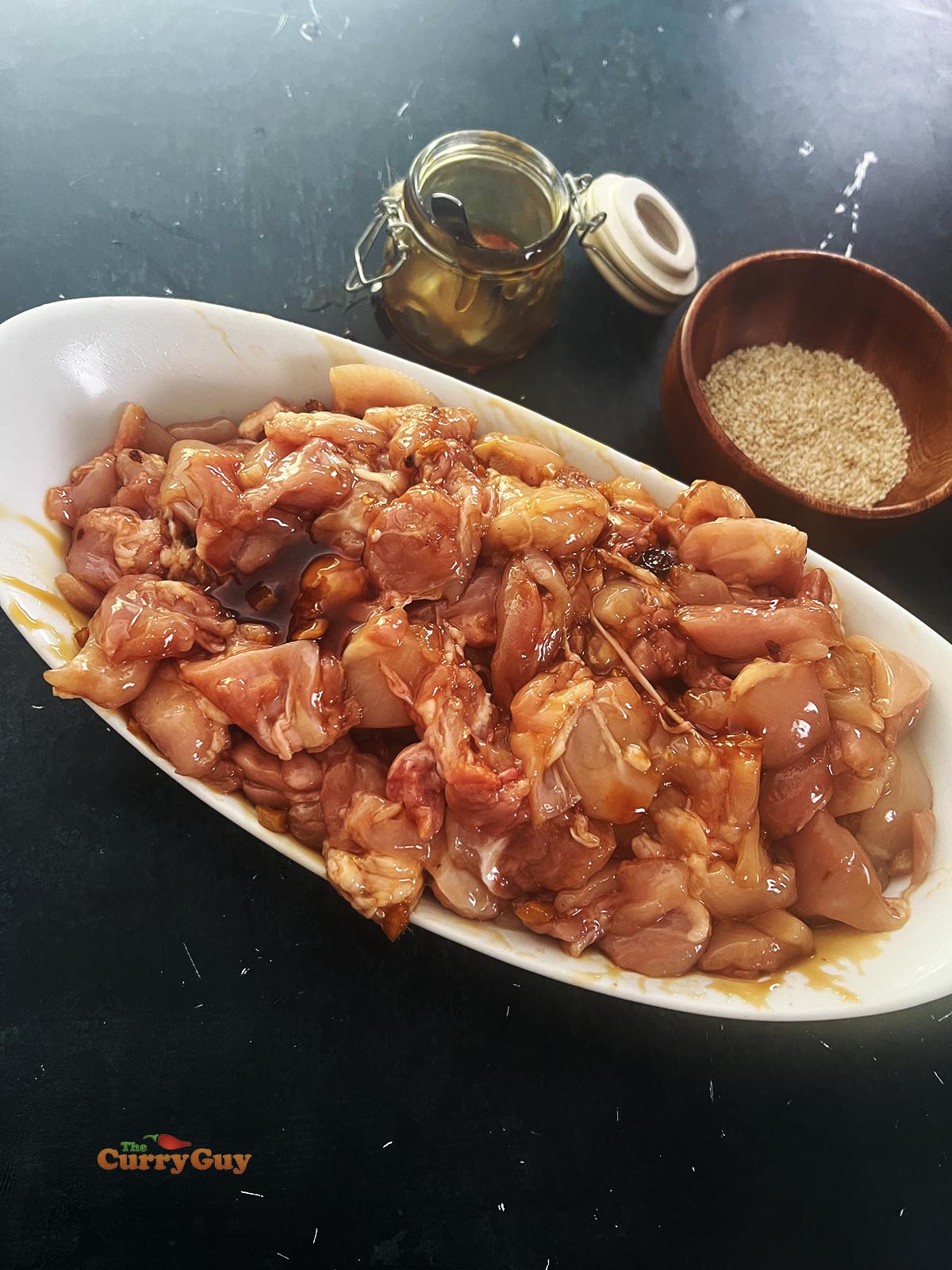 Chicken marinating in teriyaki sauce.