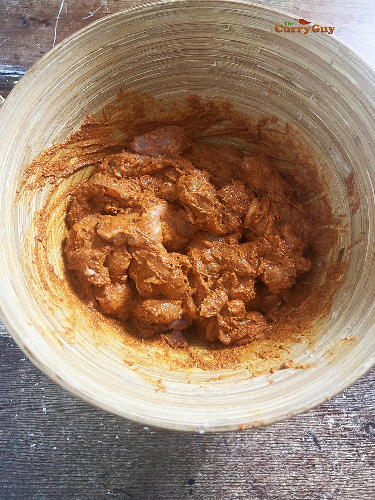 Chicken marinating in the butter chicken marinade.