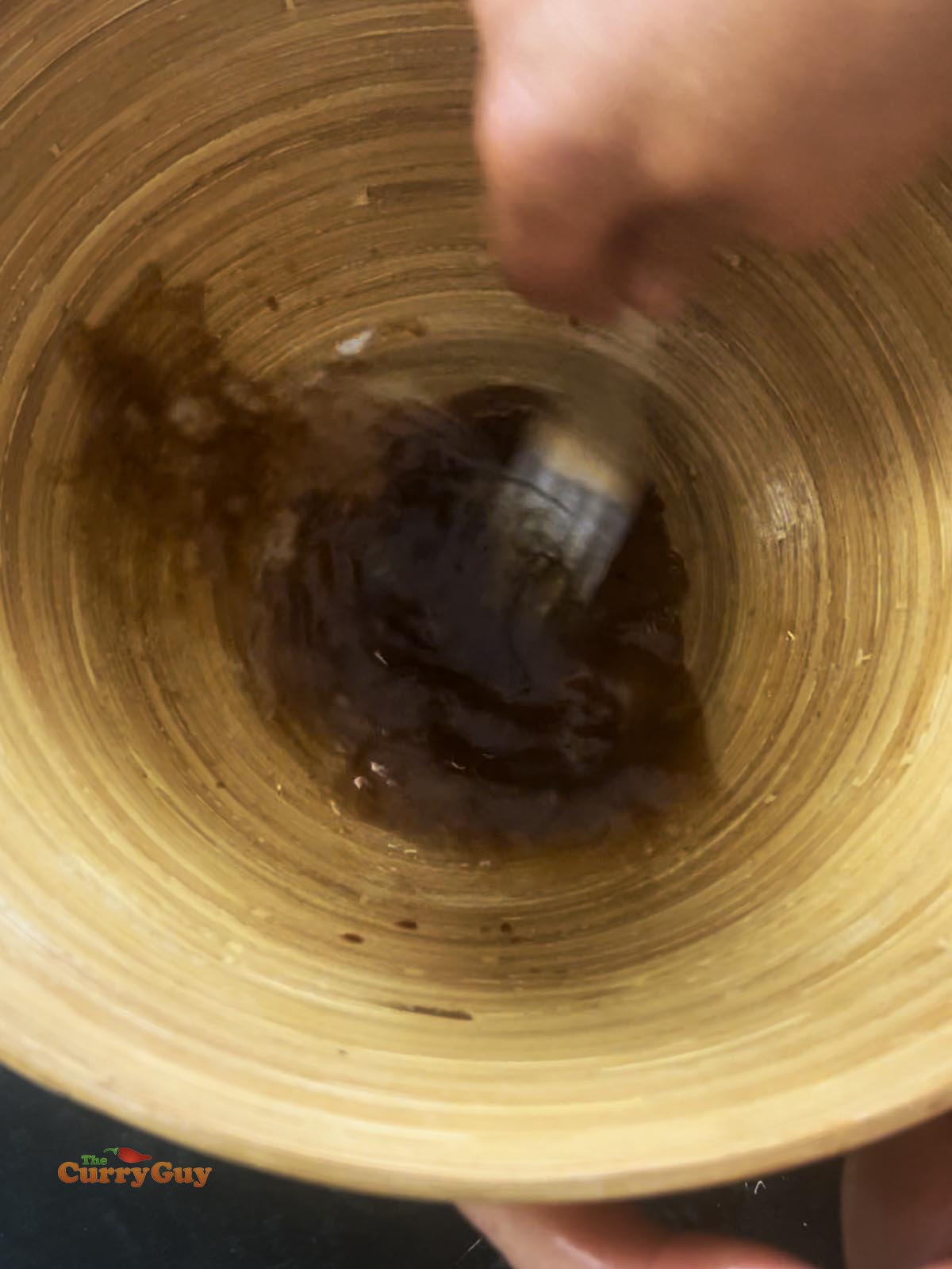Whisking the salad dressing ingredients together