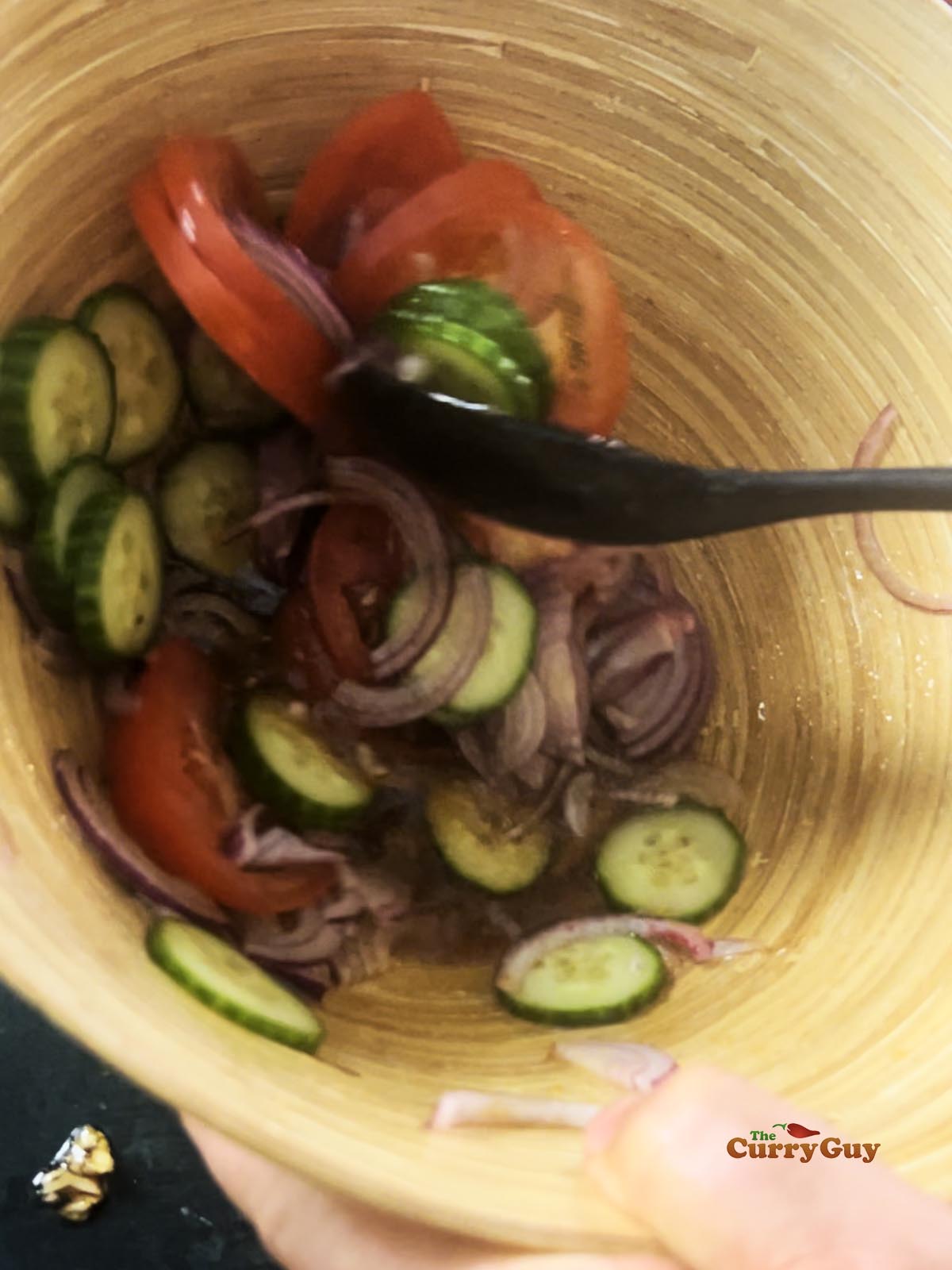 Vegetables mixed with the salad dressing.