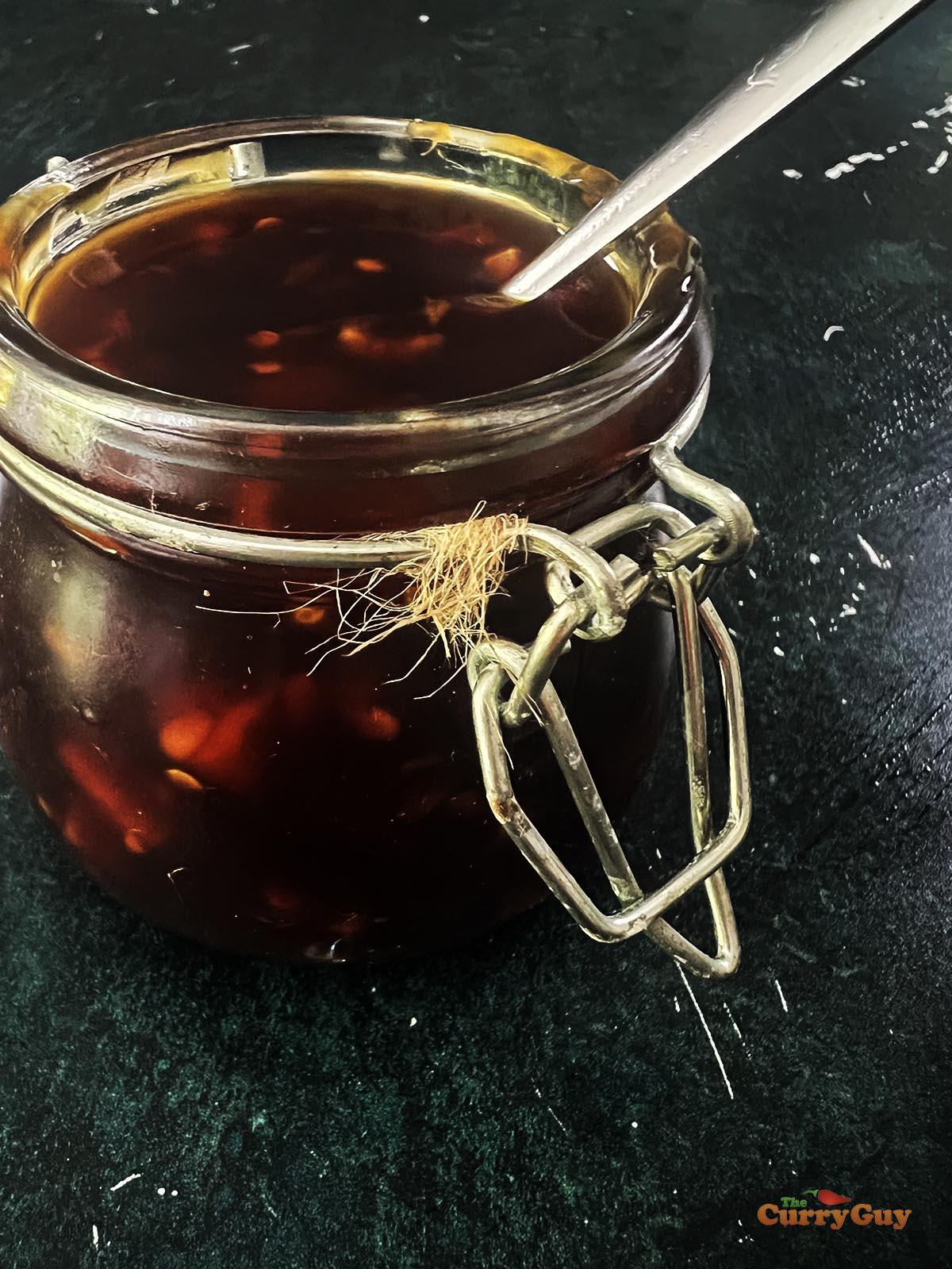 Spicy teriyaki sauce in a glass jar.