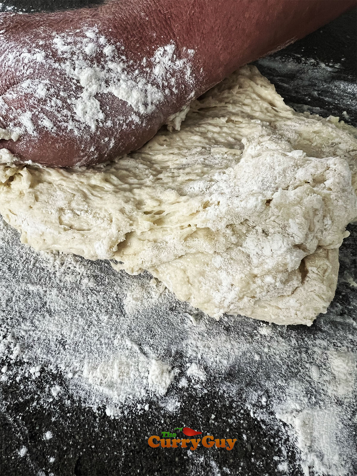 Kneading the dough on a floured surface.