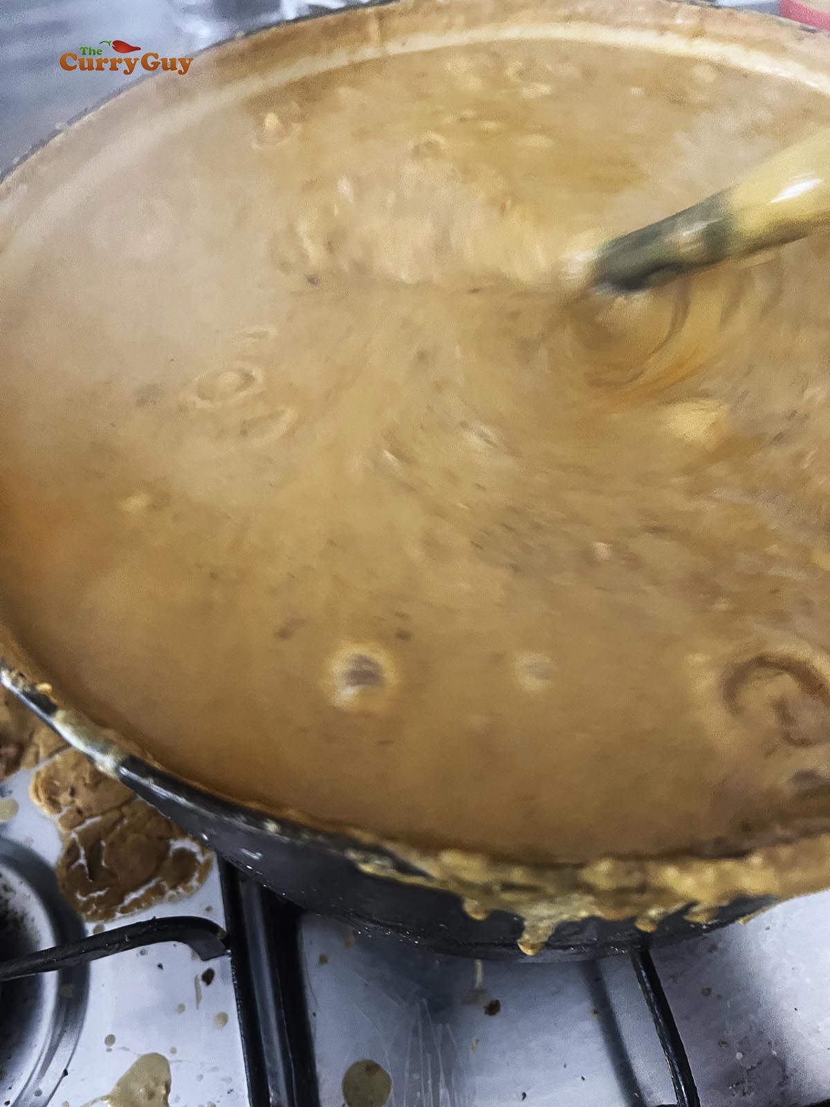 Reducing the sauce to thicken.