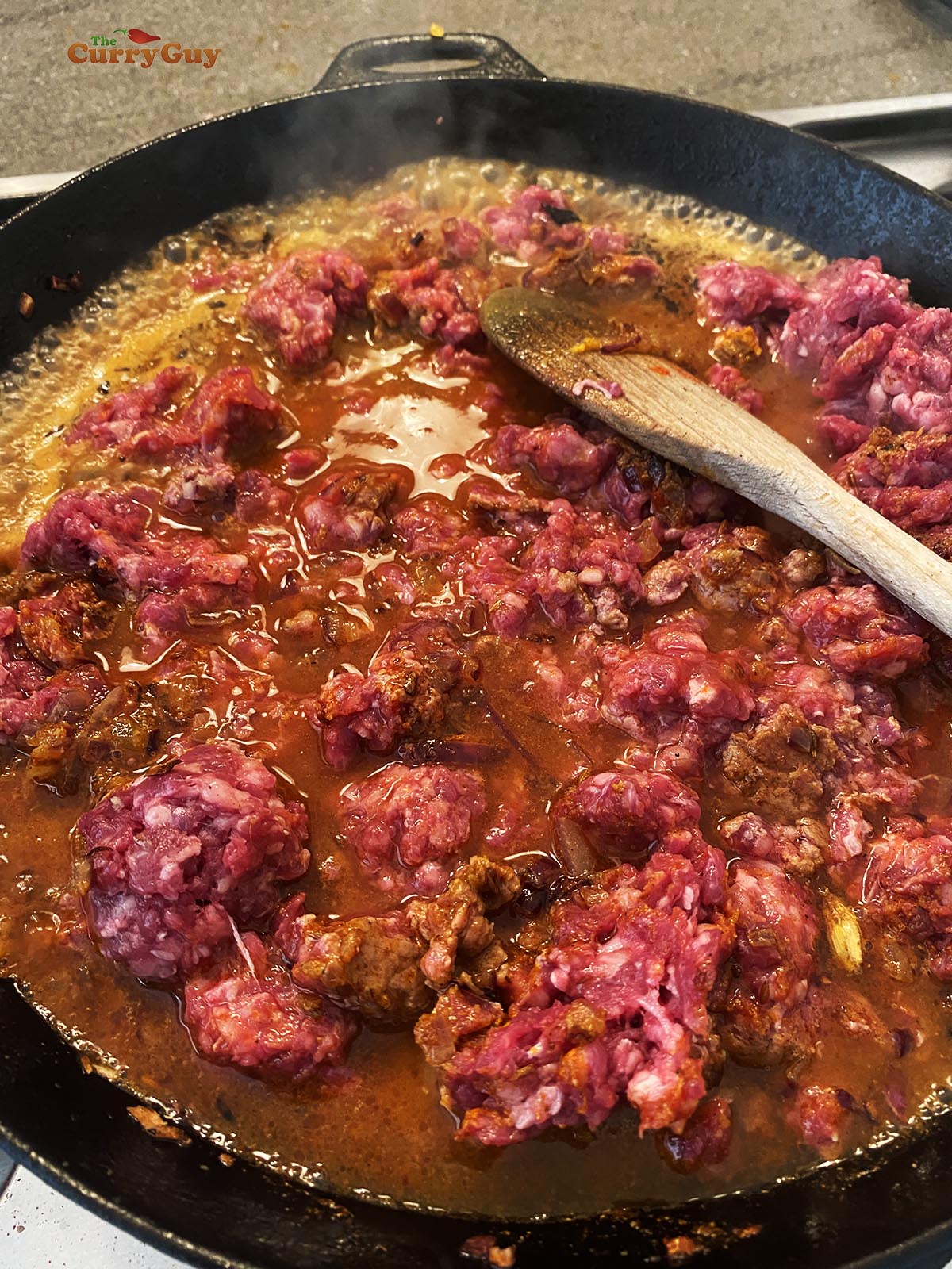 Adding water to the pan.