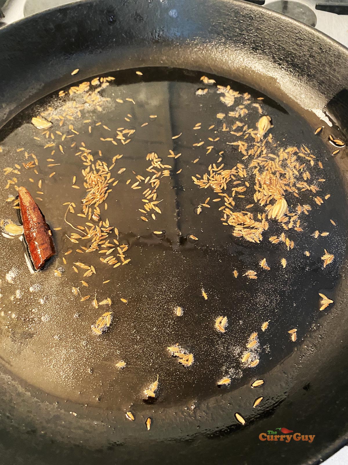 Infusing whole spices in oil.