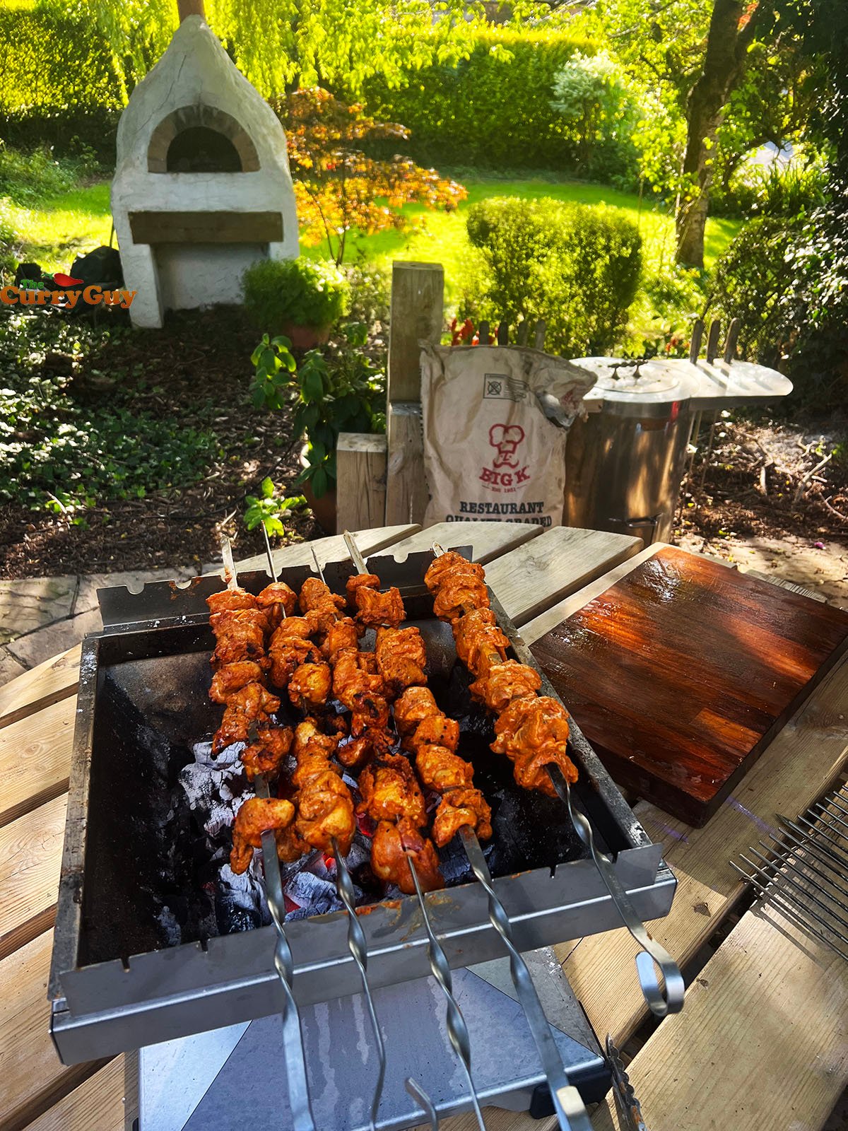 Cooking the chicken over the hot coals