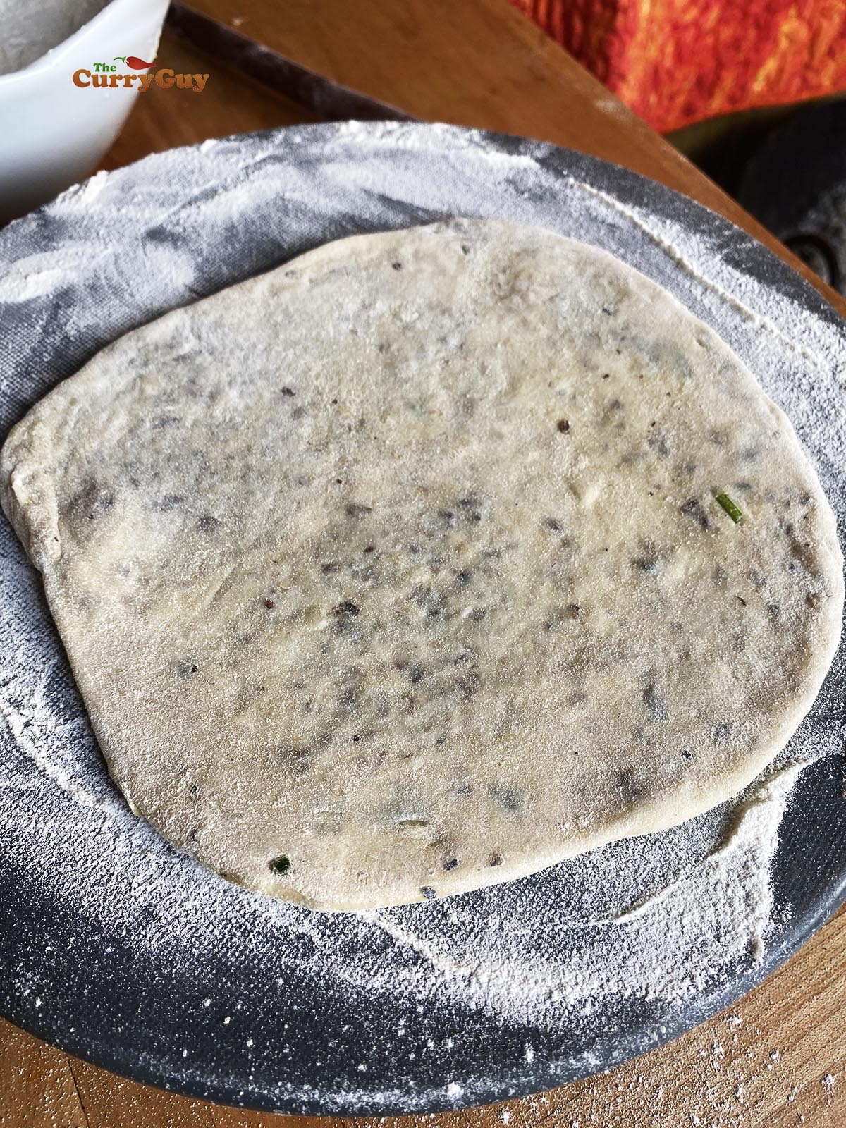 One rolled out kulcha ready for cooking. 