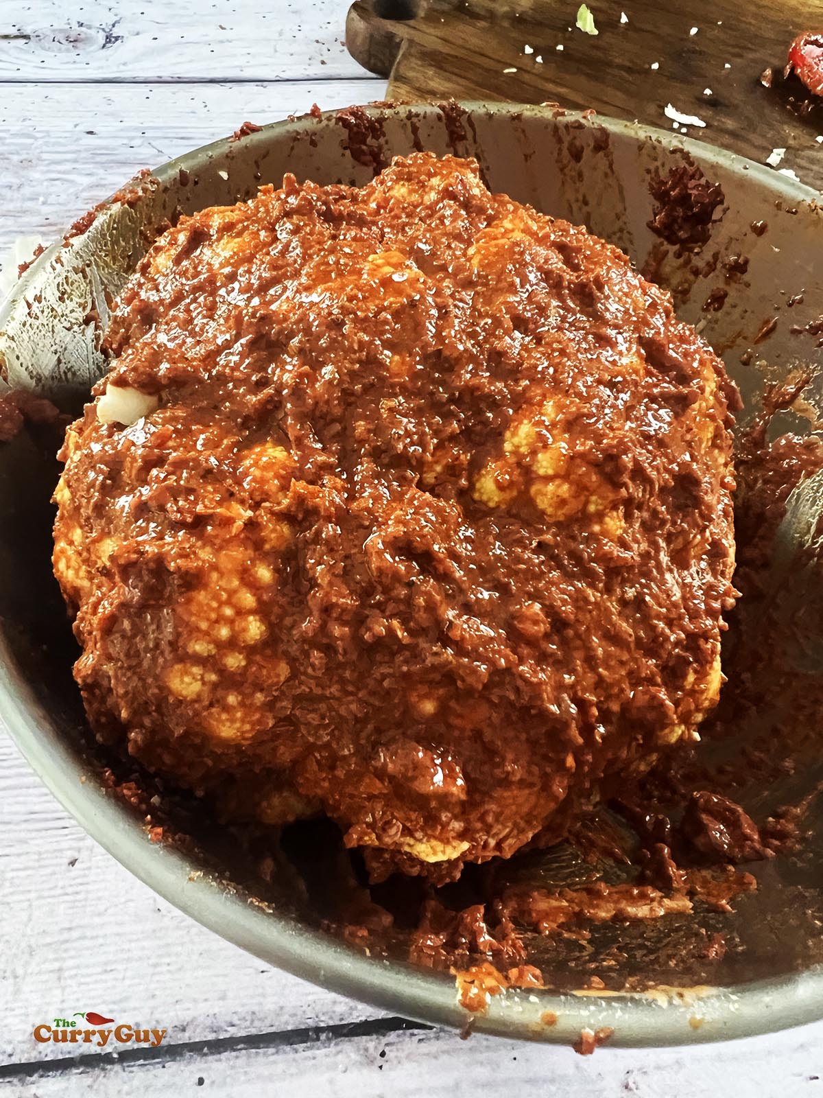 The tandoori cauliflower in the tandoori marinade.