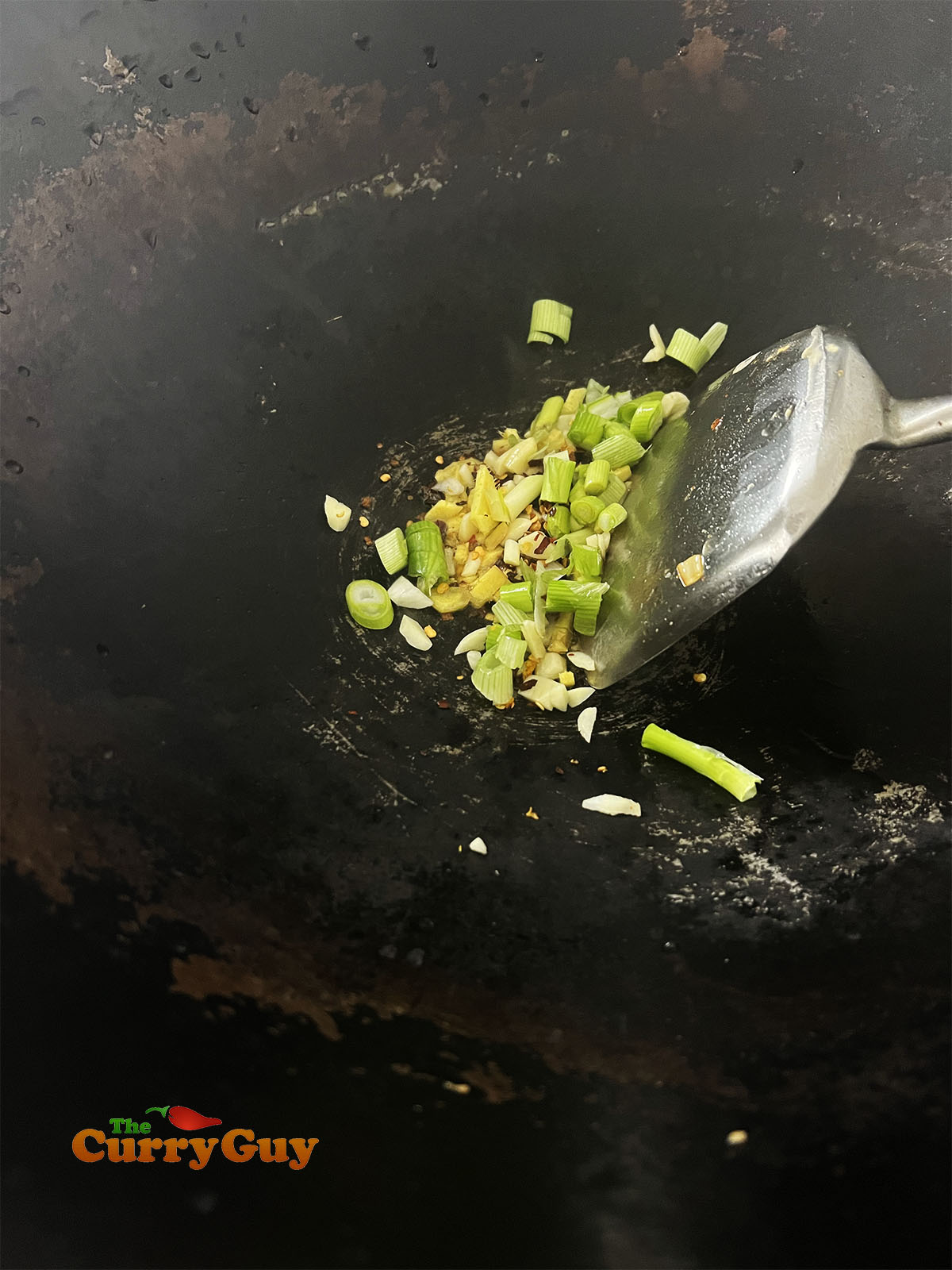 Frying the aromatic ingredients.