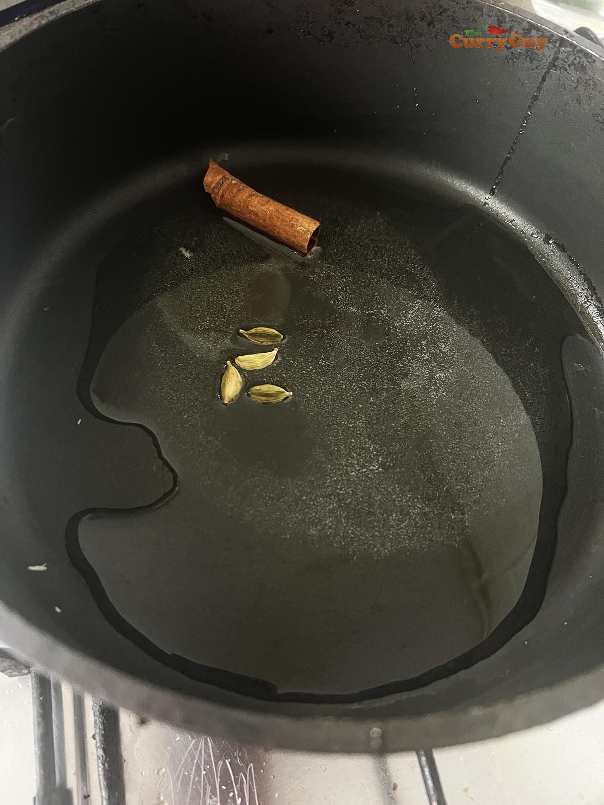 Infusing whole spices in oil.