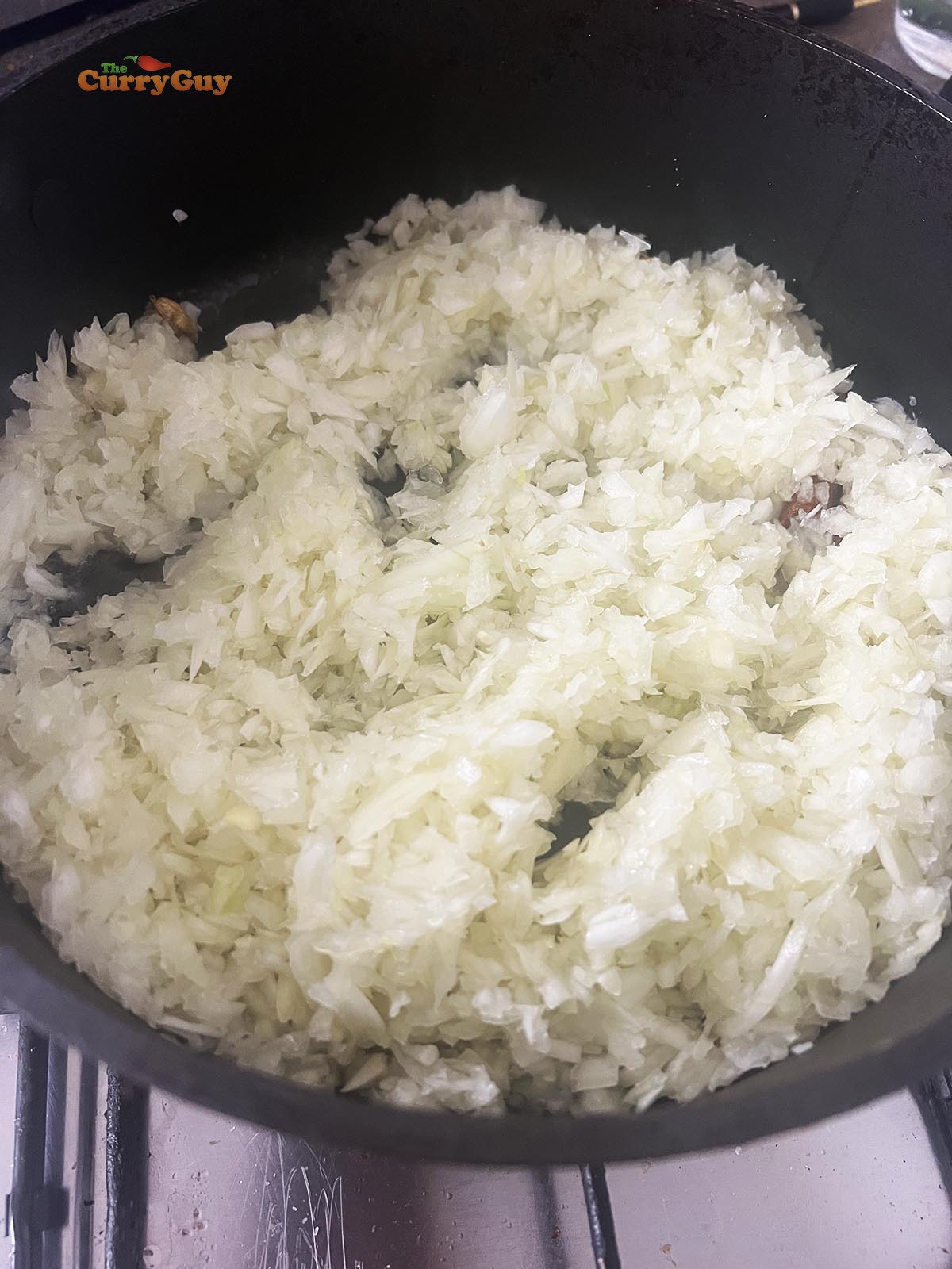 Frying onions in a pan.