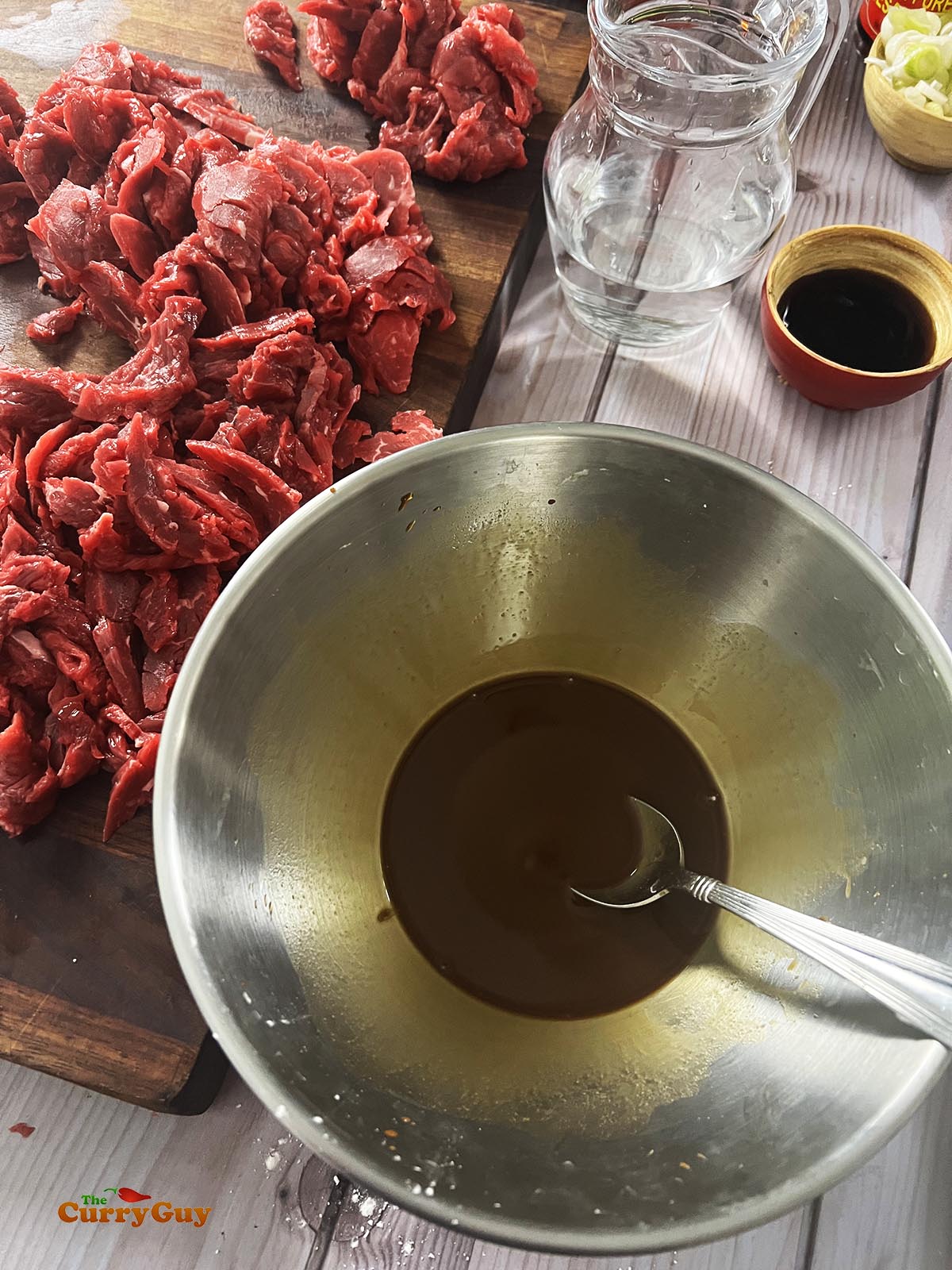 Whisking the marinade ingredients together.