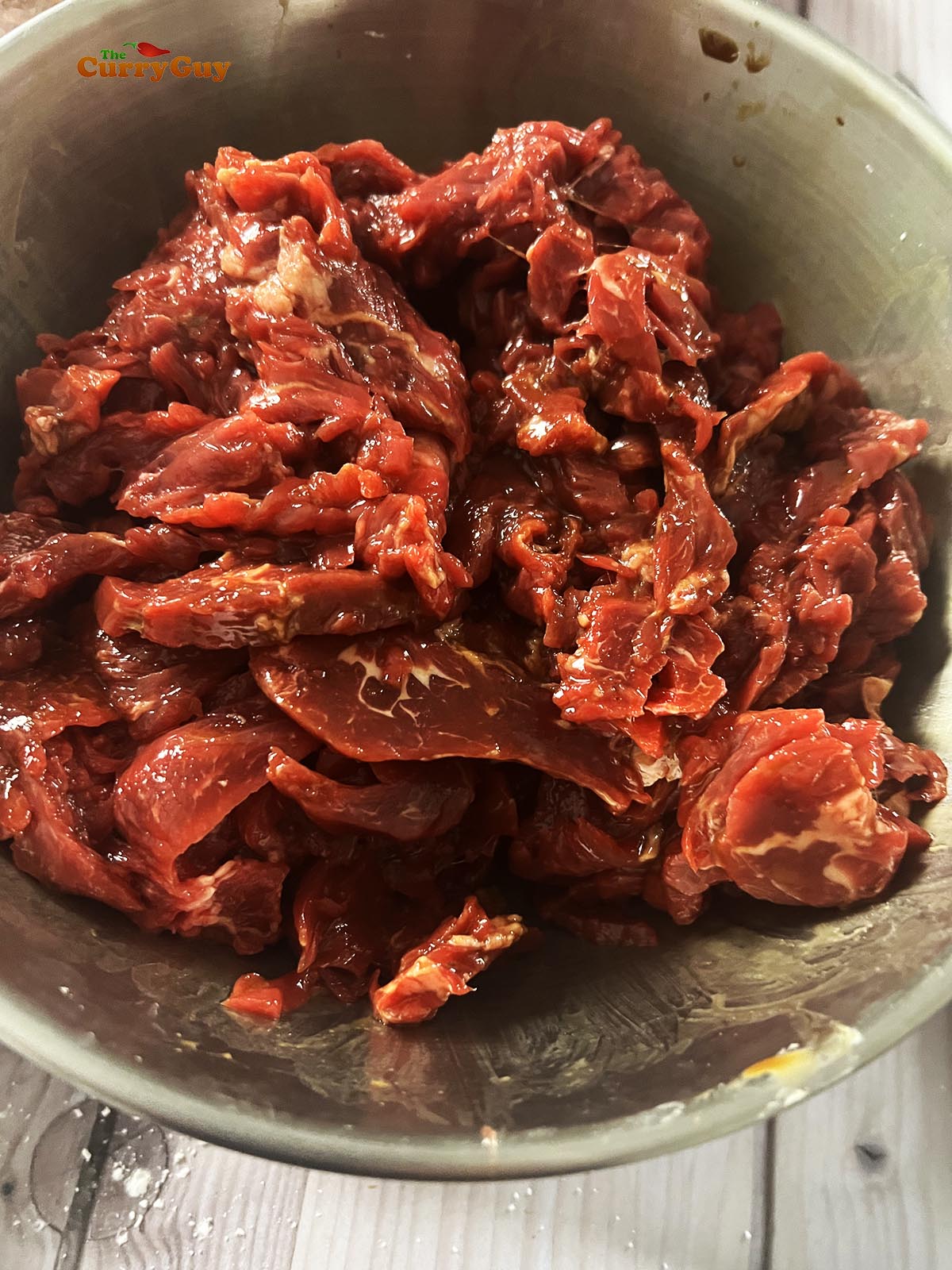 Marinating the beef.