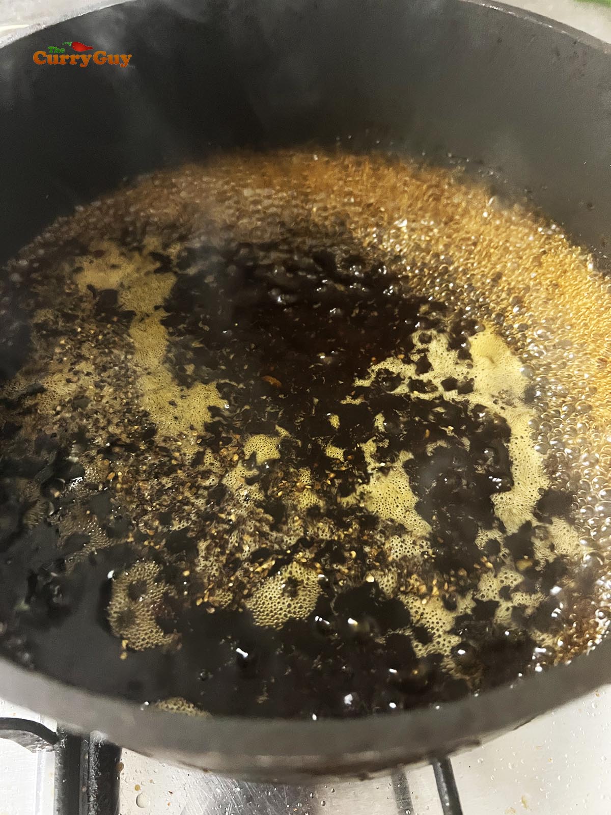 Simmering the sauce.