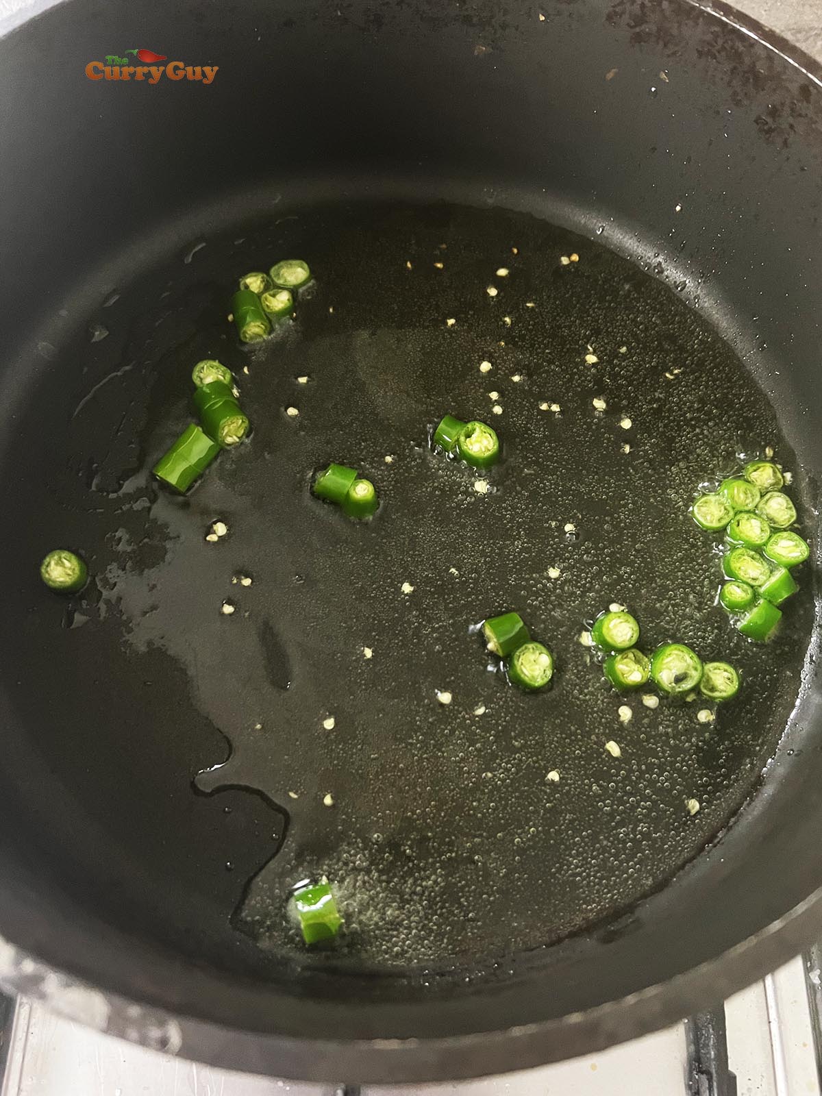 Frying green chillies