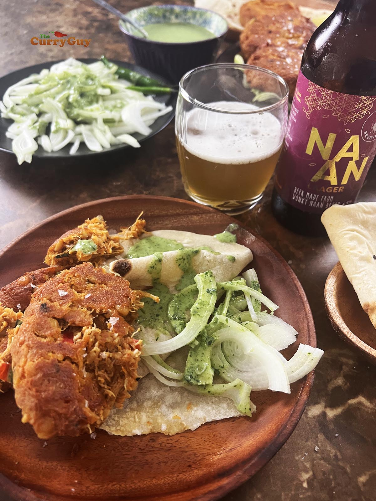 Chicken shami kebabs served on a plate with rumali rotis.
