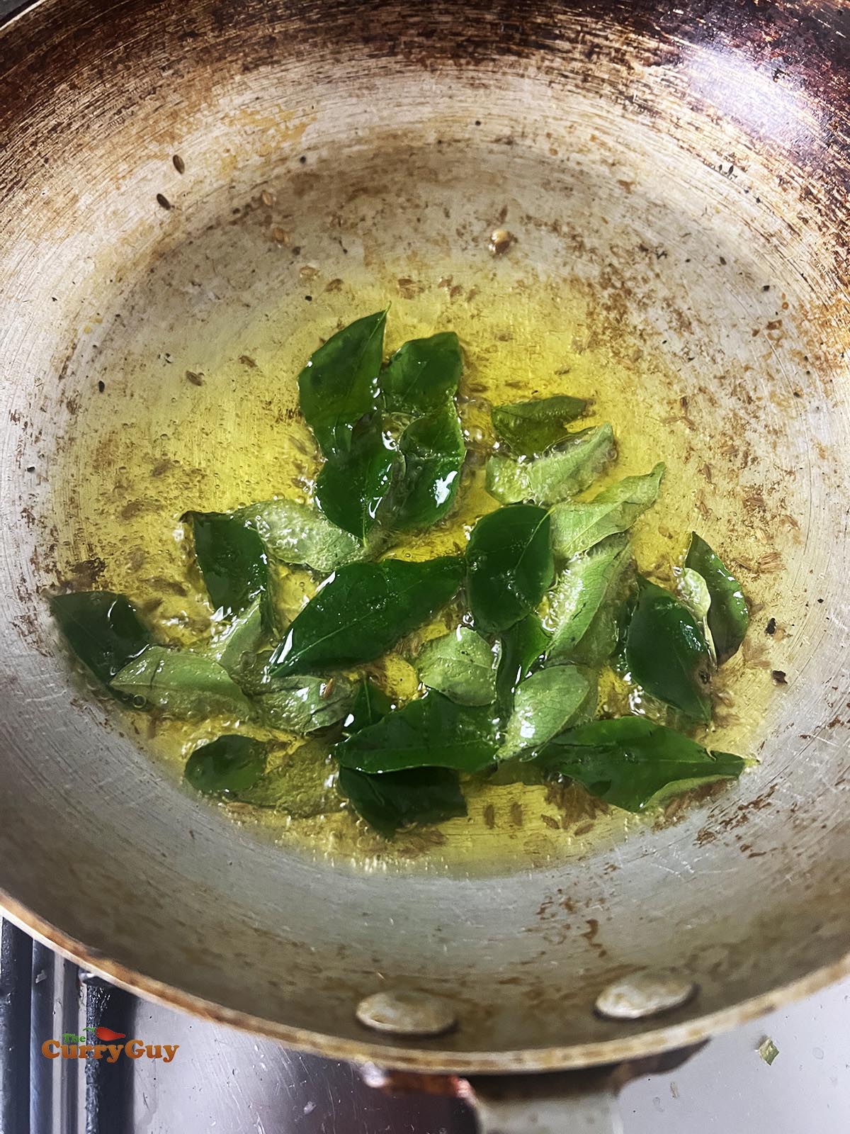 Preparing the tarka for the hummus