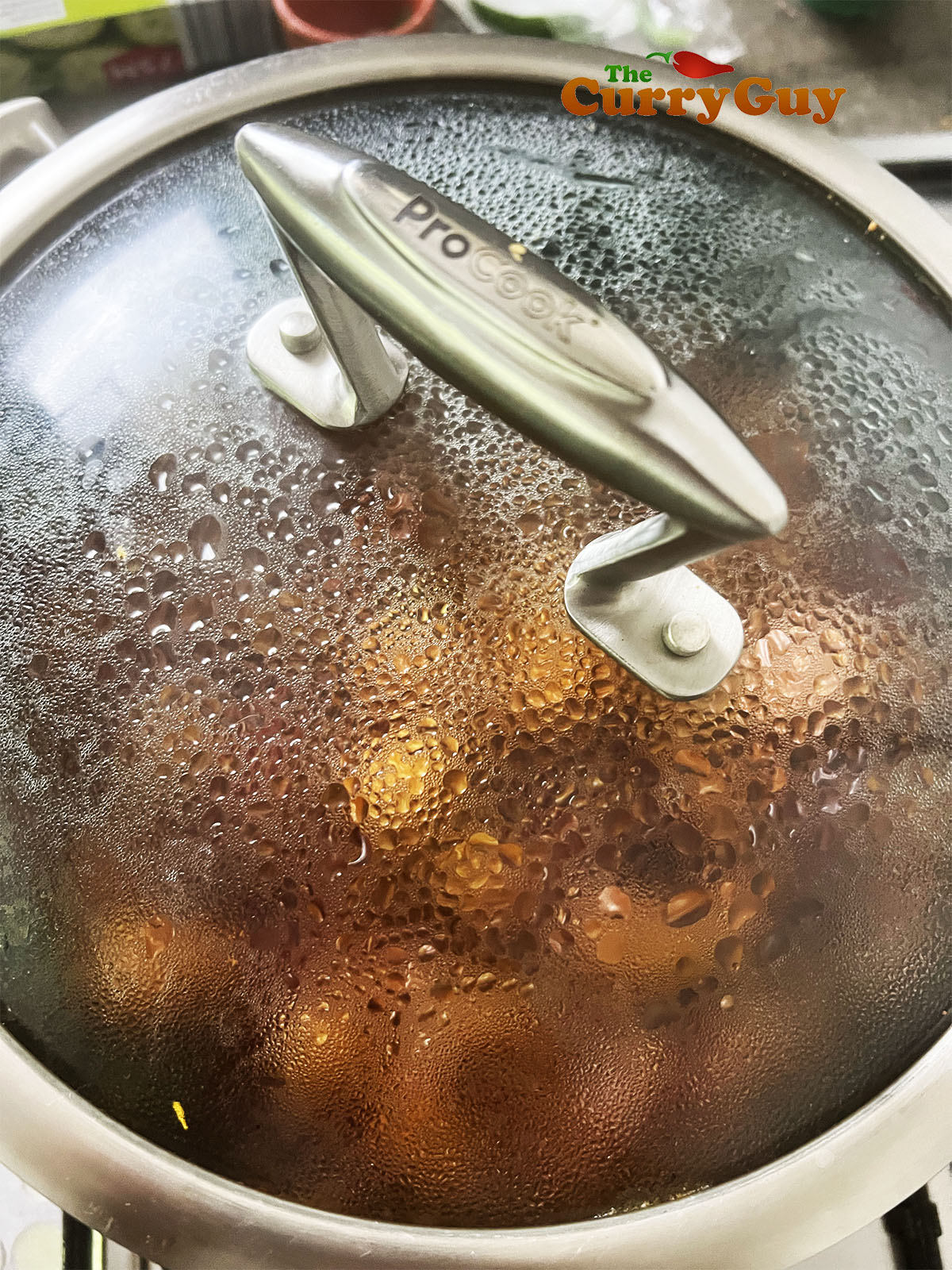Covering the pan to allow the flavours to develop.
