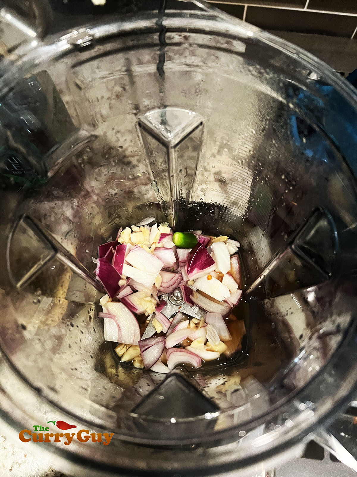 Pulsing the aromatic ingredients in a blender.