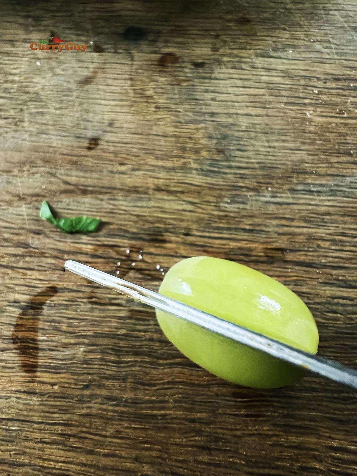 Slicing a grape in half