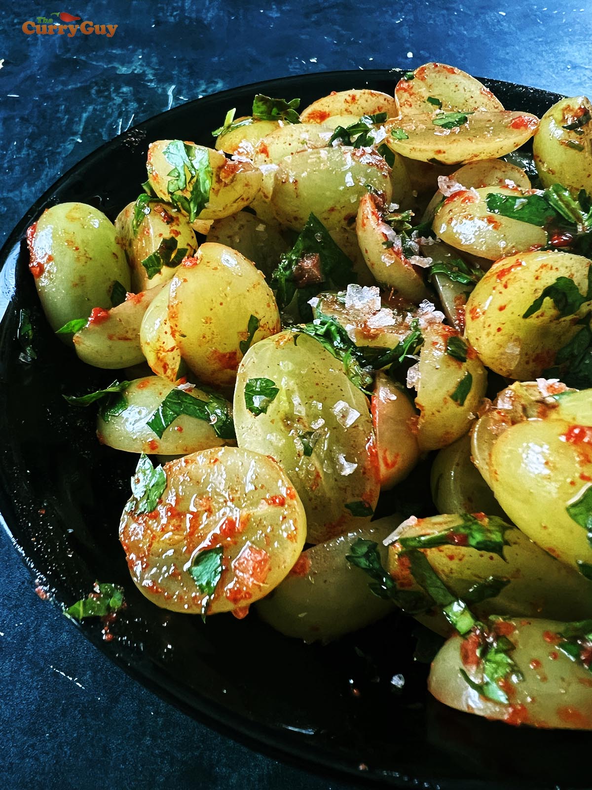 Grapes mixed with chili, salt, lime juice and coriander (cilantro).