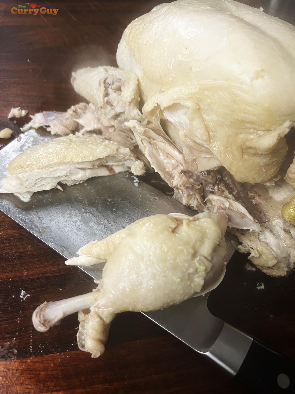 Cutting the chicken into small pieces.