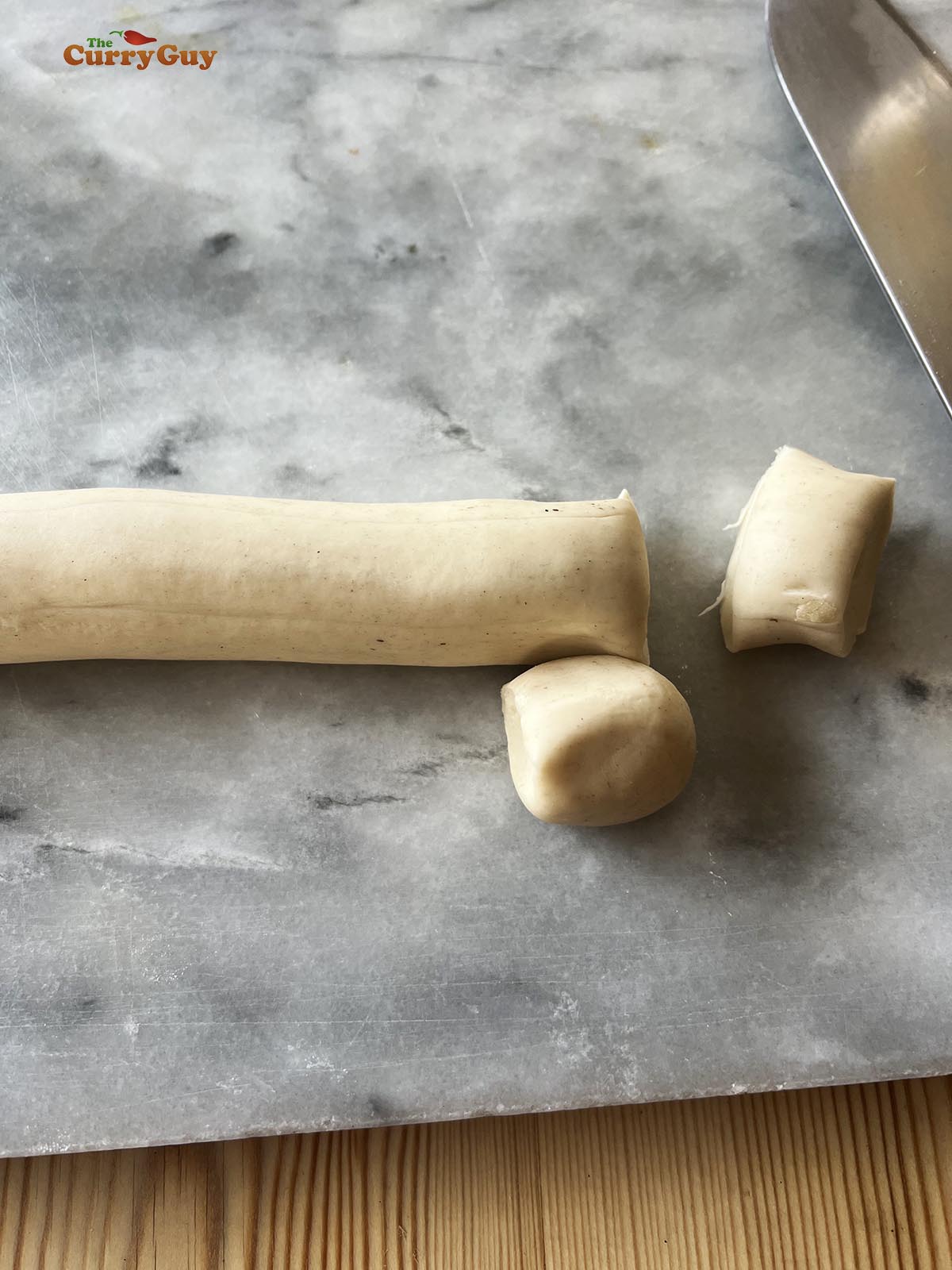Dividing the dough for the wrappers.