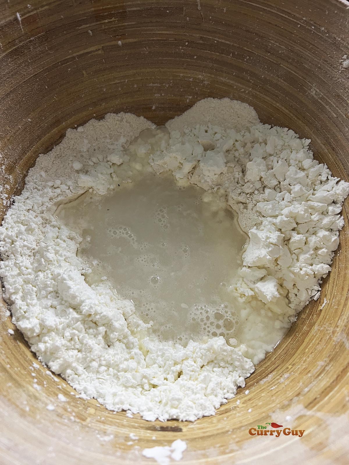 Mixing the flours and water to make the dough for the wrappers.