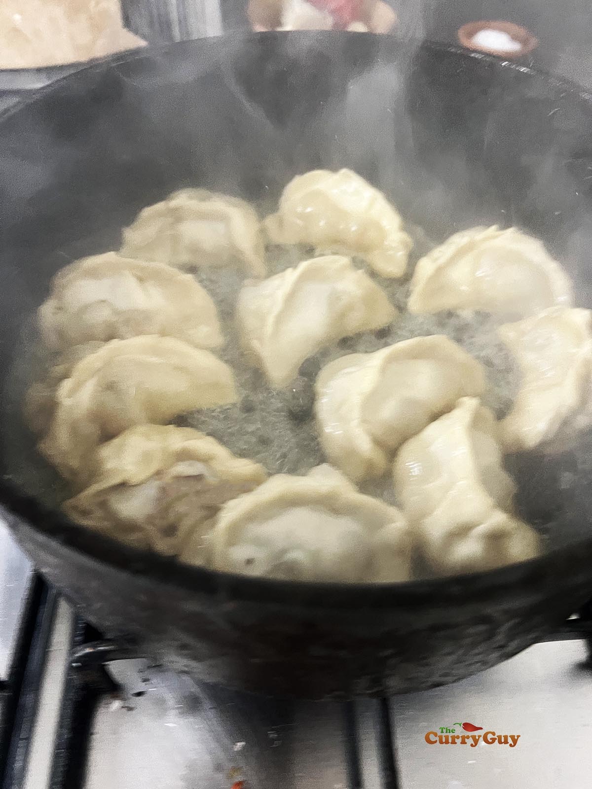 Frying the potstickers.