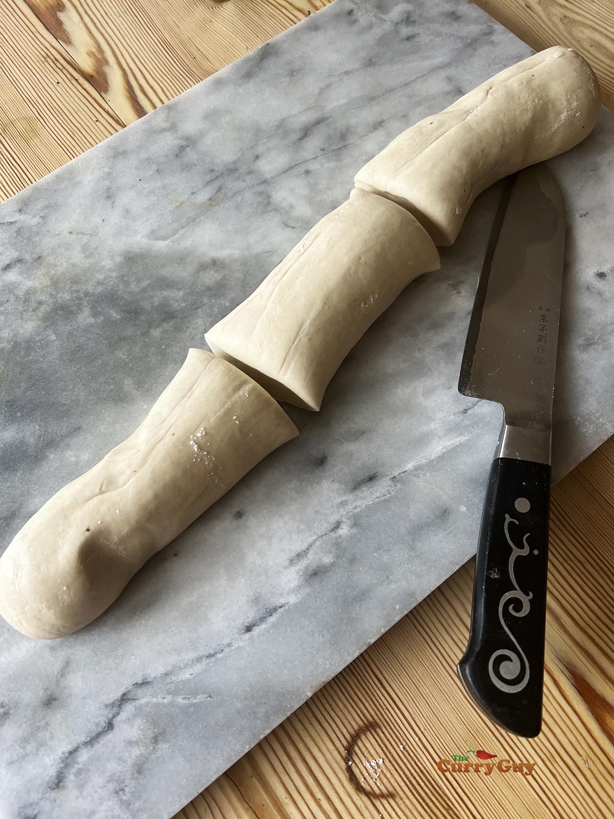 The potsticker dough rolled out and divided.
