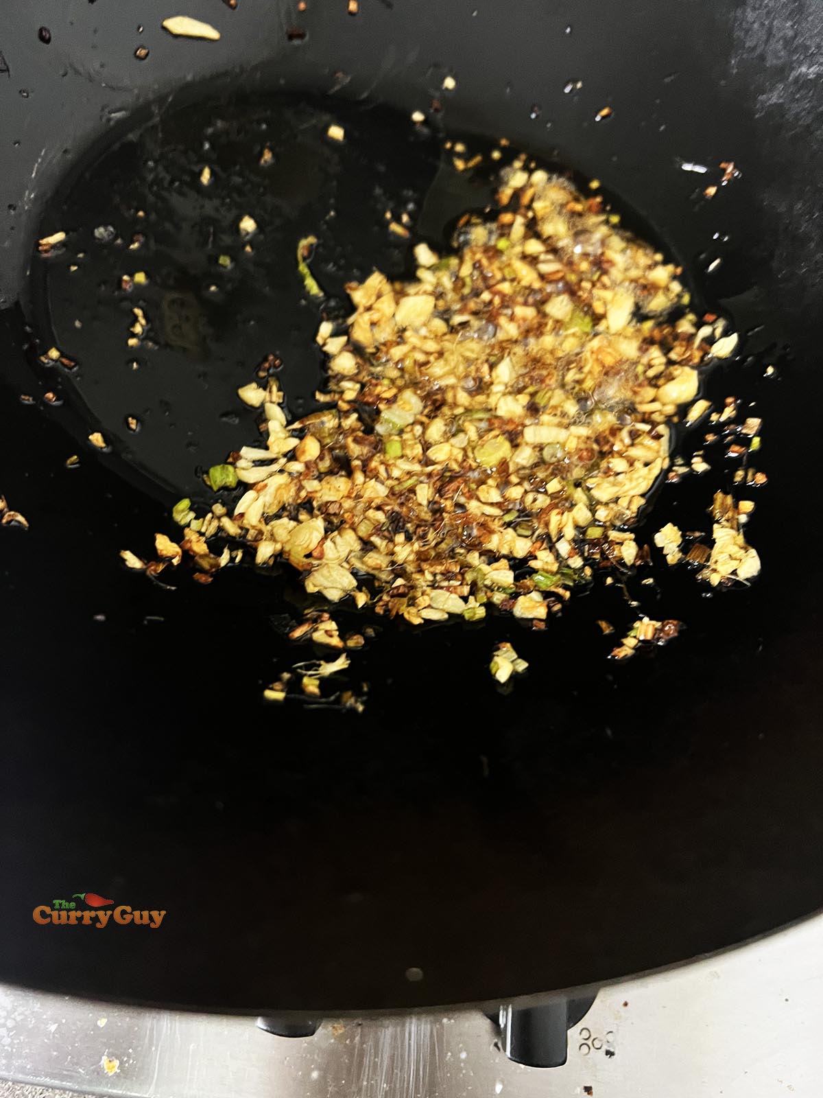 The garlic, ginger and spring onions fried until lightly browned. 