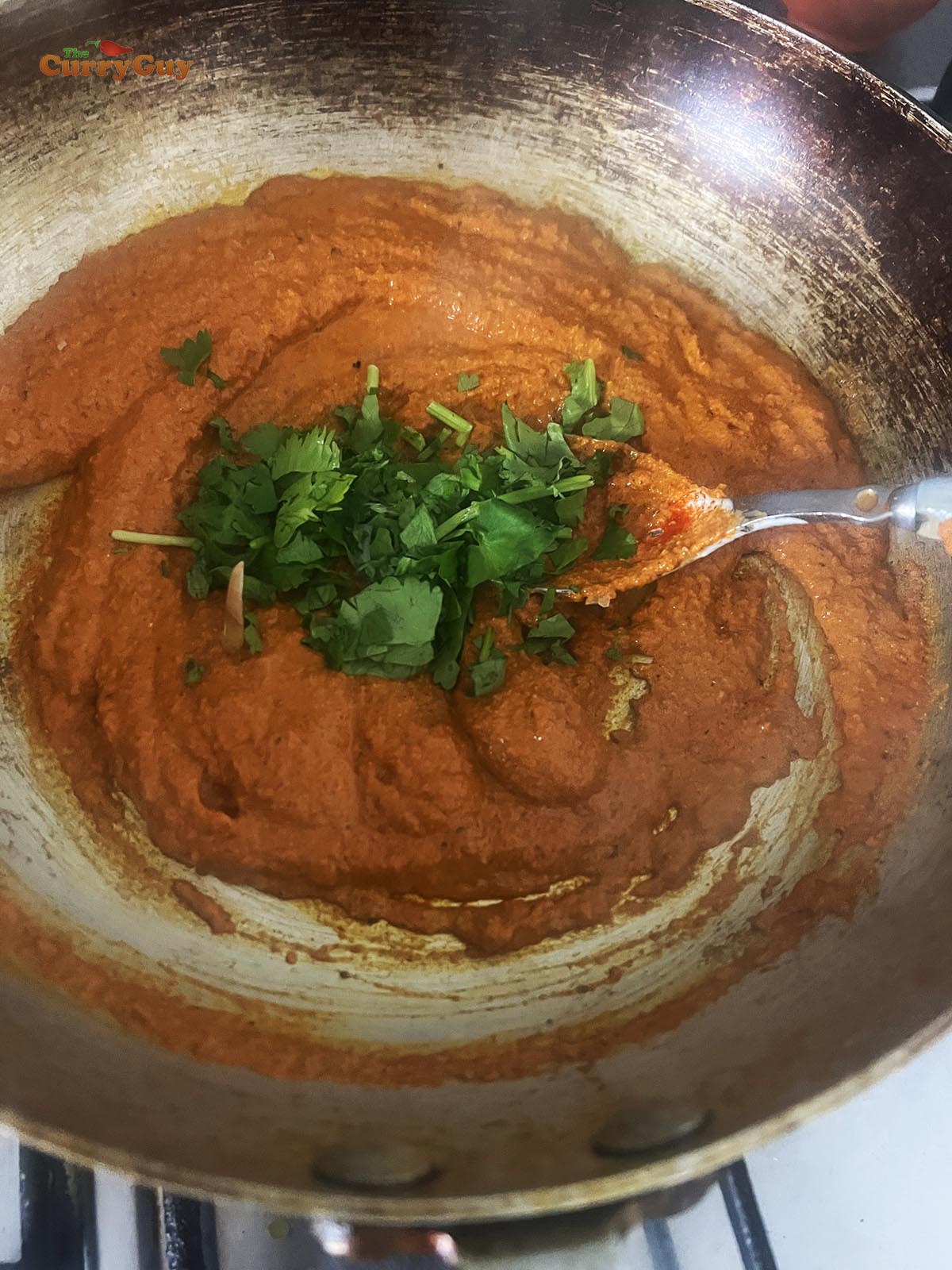 Heating tandoori marinade.