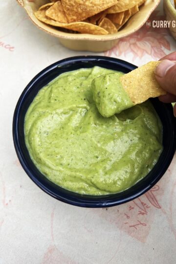 Tomatillo and avocado salsa with corn chips.