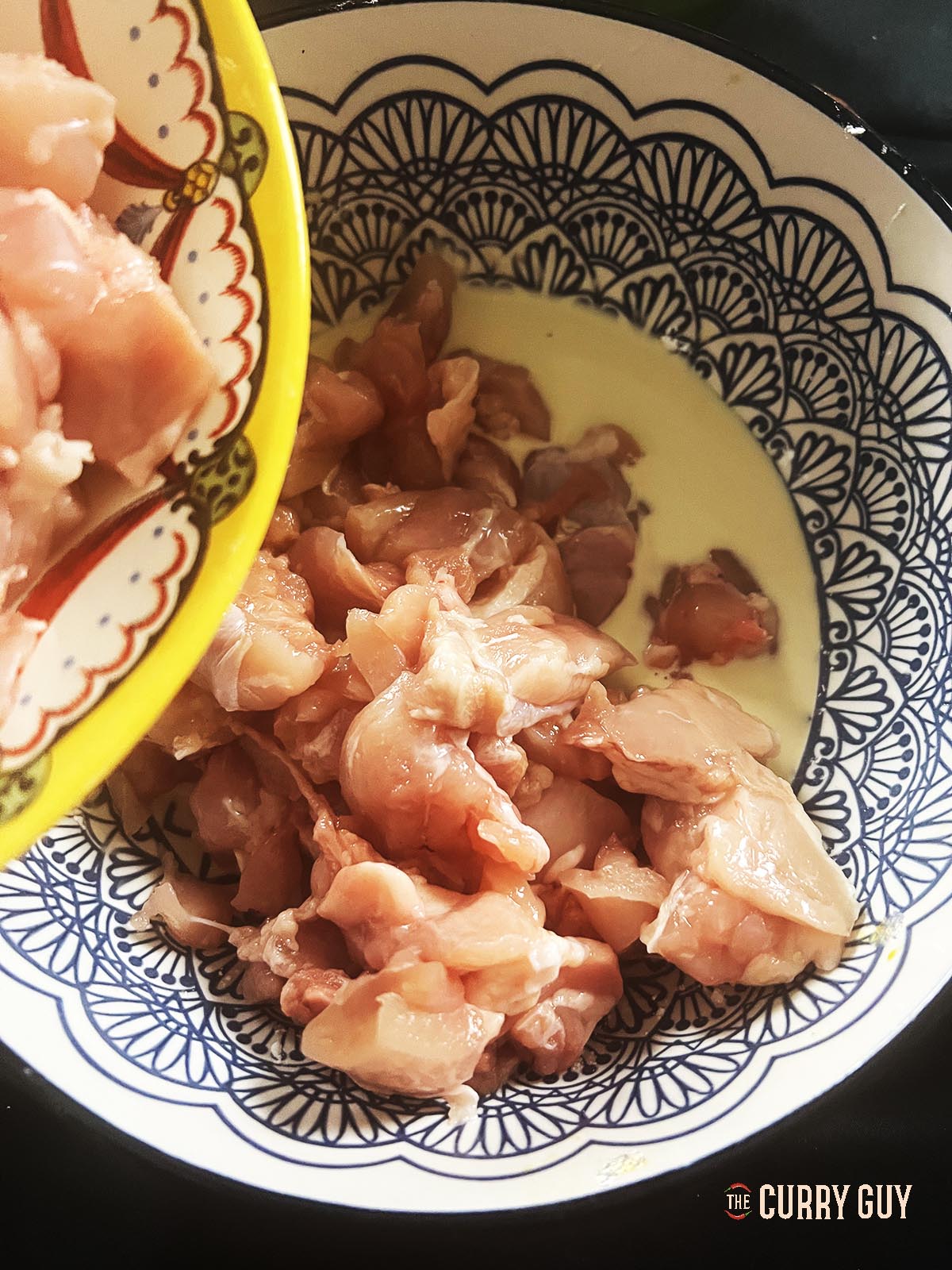 Marinating the chicken pieces in the marinade.