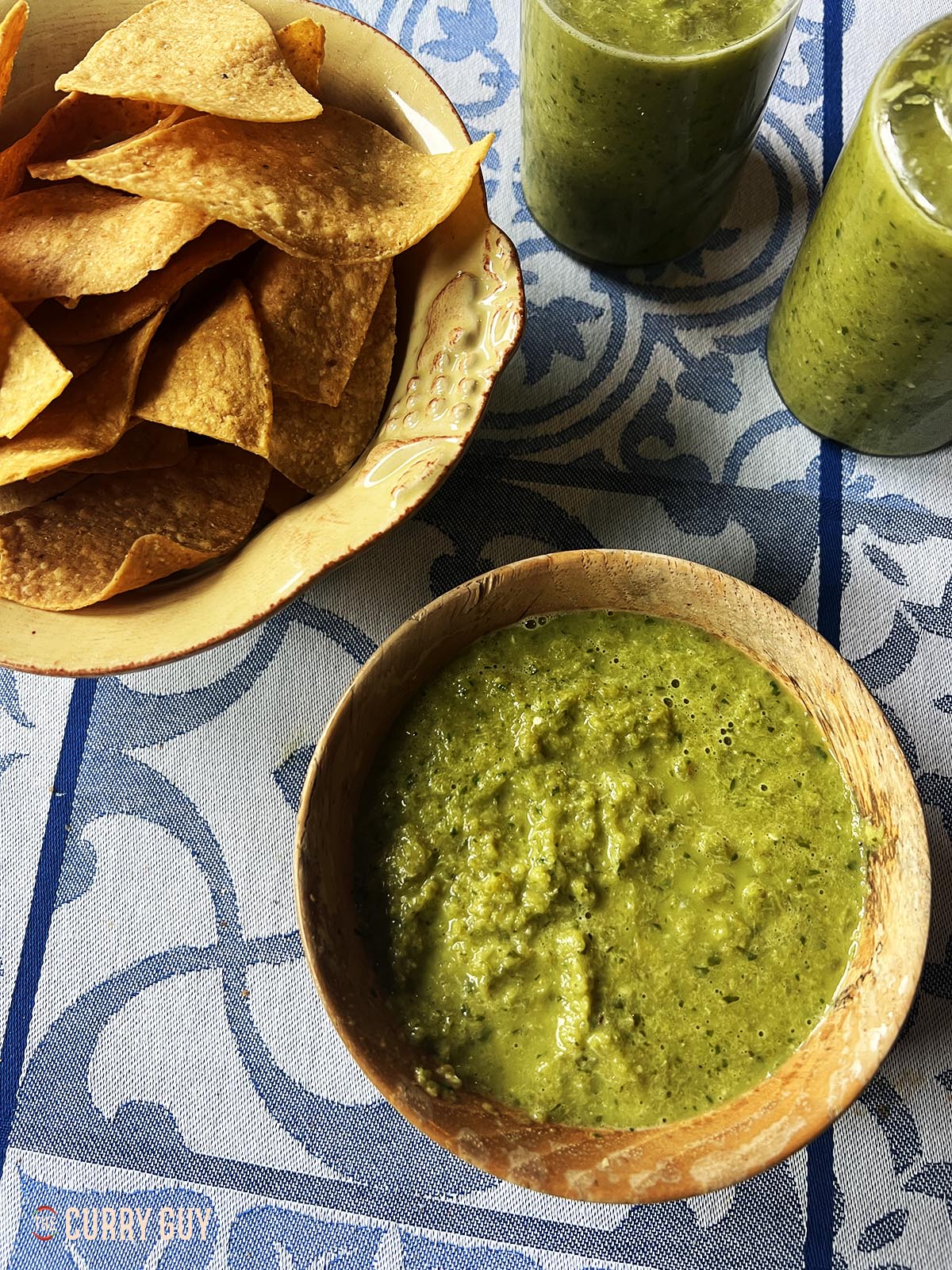 Jalapeño hot sauce in a serving bowl with corn chips.